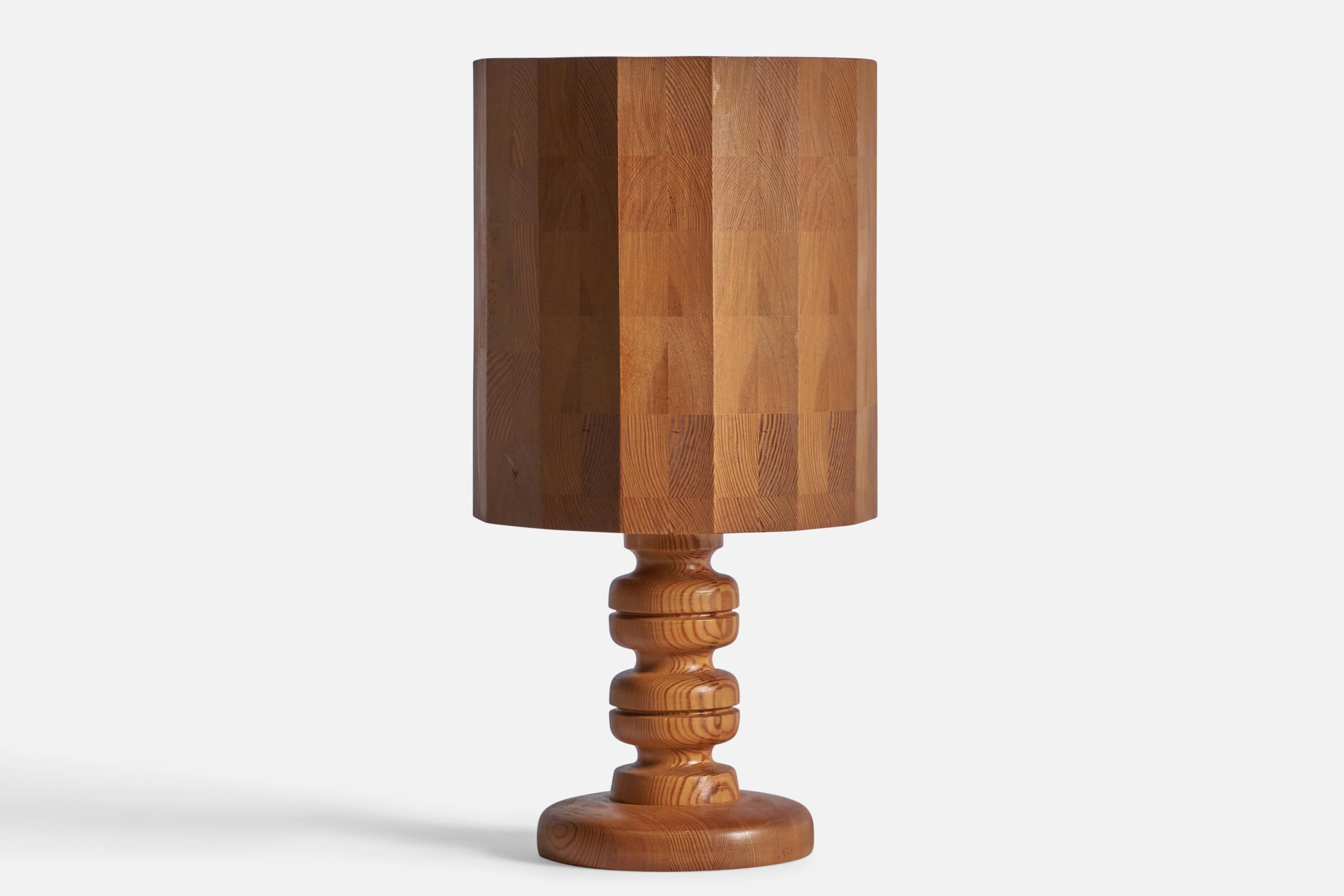 A sizeable solid pine table lamp, designed and produced in Sweden, 1970s.