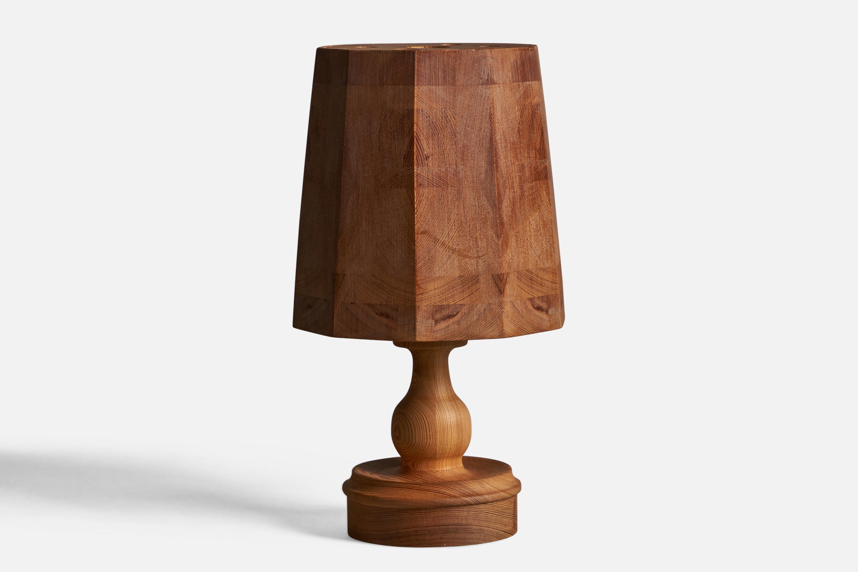 A pine table lamp, designed and produced in Sweden, 1970s.

Overall Dimensions (inches): 15.5