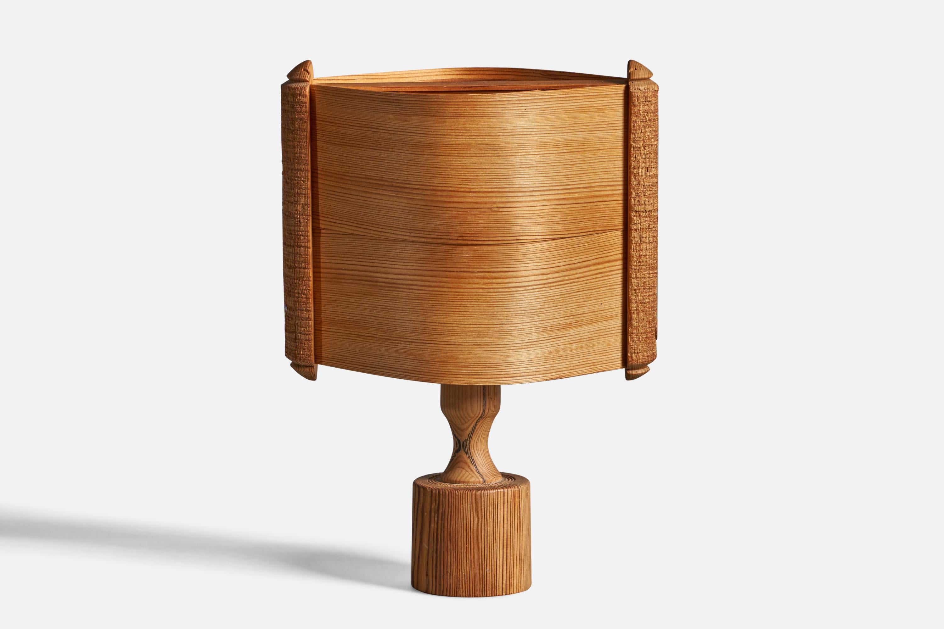 A pine and moulded pine-veneer table lamp designed and produced in Sweden, 1970s.

Overall Dimensions (inches): 14.25