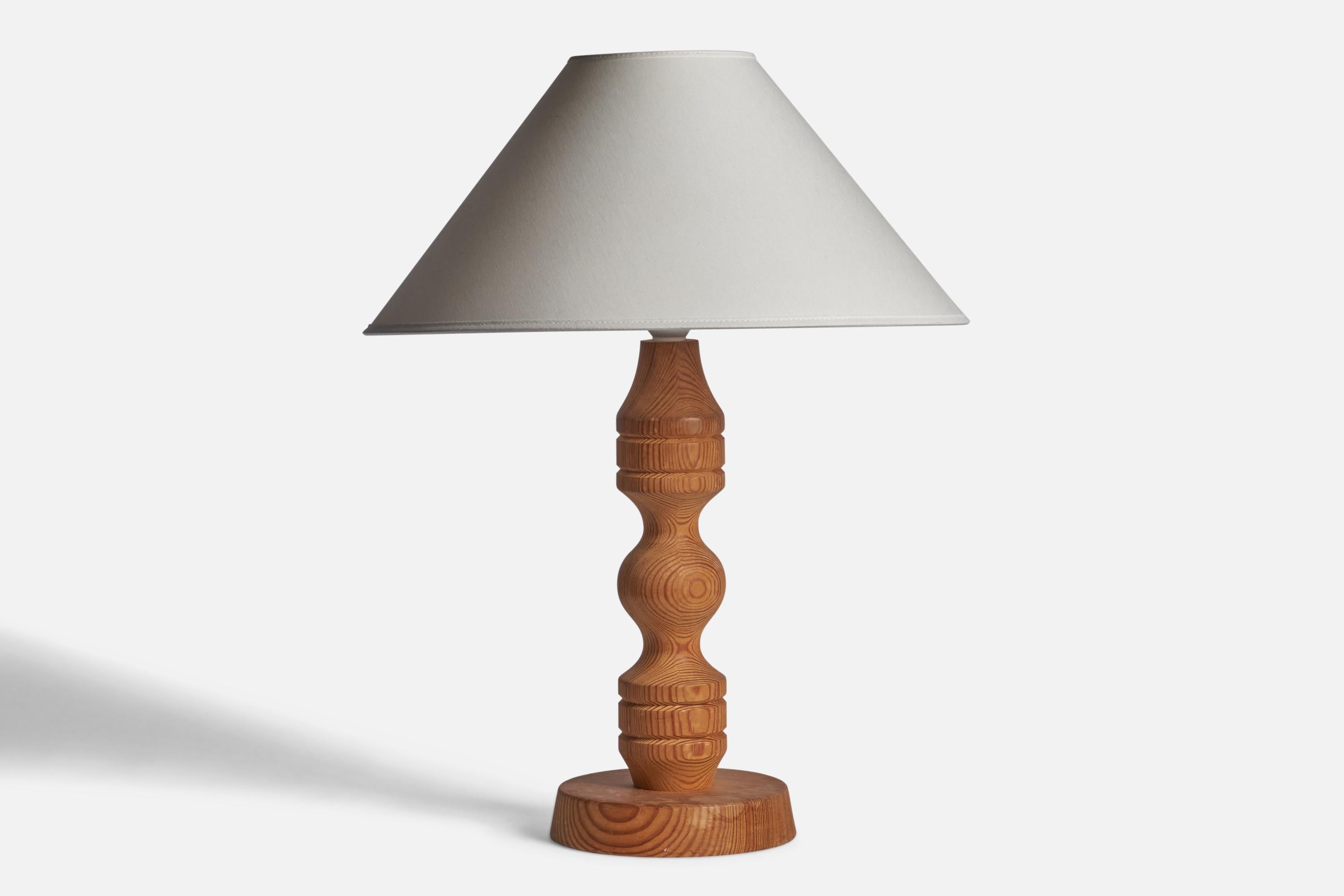 A pine table lamp designed and produced in Sweden, 1970s.

Dimensions of Lamp (inches): 15.75” H x 6.5” Diameter
Dimensions of Shade (inches): 4.5” Top Diameter x 16” Bottom Diameter x 7.25” H
Dimensions of Lamp with Shade (inches): 20.75” H x 16”