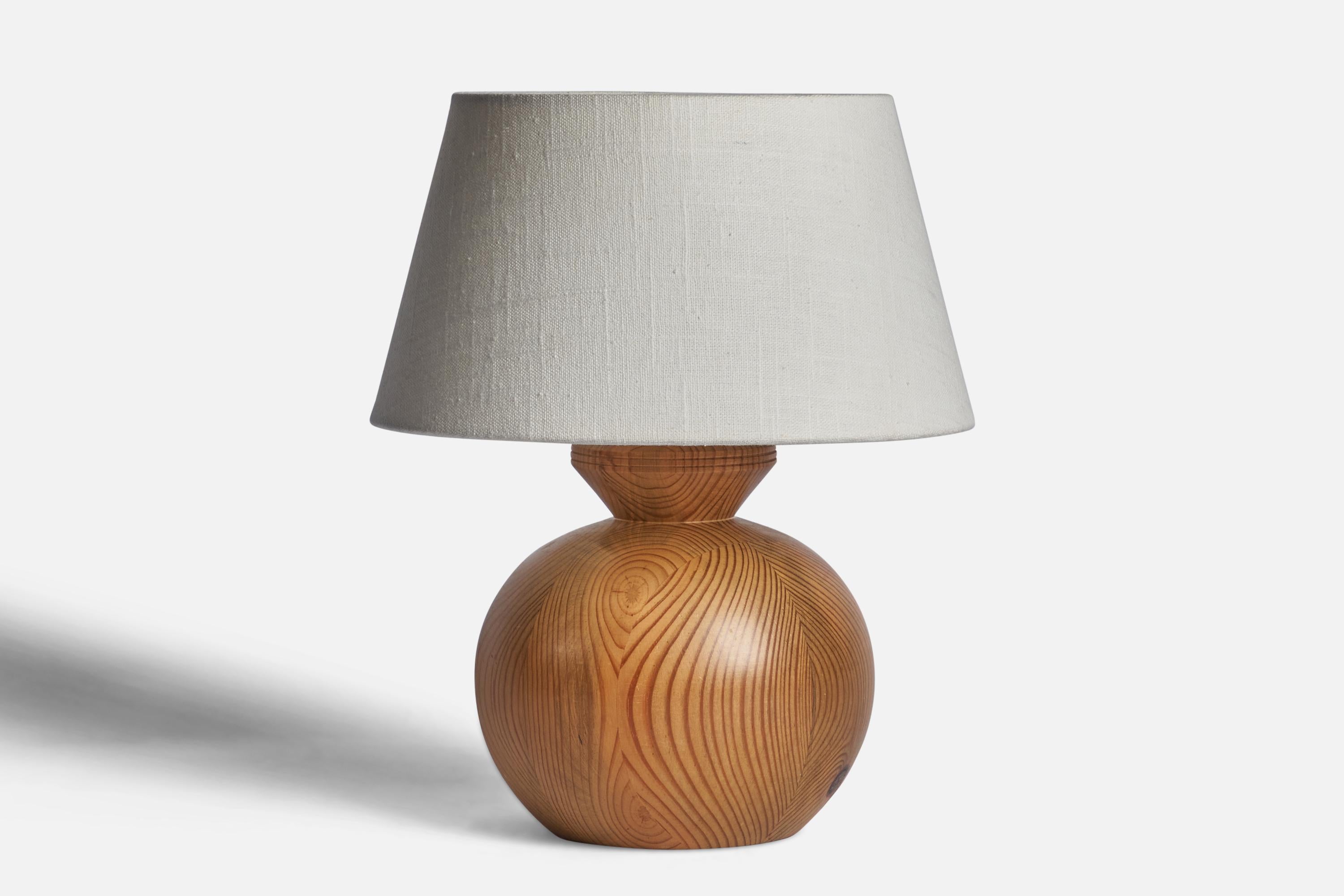 A pine table lamp designed and produced in Sweden, 1970s.

Dimensions of Lamp (inches): 9.25” H x 6.5” Diameter
Dimensions of Shade (inches): 7” Top Diameter x 10” Bottom Diameter x 5.5” H 
Dimensions of Lamp with Shade (inches): 12.45” H x