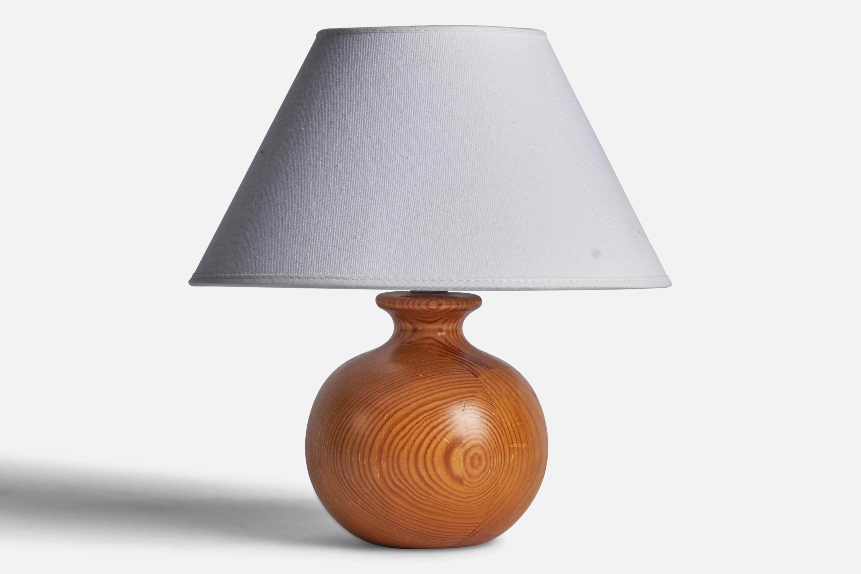 A pine table lamp designed and produced in Sweden, c. 1970s.

Dimensions of Lamp (inches): 7.5” H x 5” Diameter
Dimensions of Shade (inches): 4.5” Top Diameter x 10” Bottom Diameter x 5.25” H 
Dimensions of Lamp with Shade (inches): 10.75” H x 10”