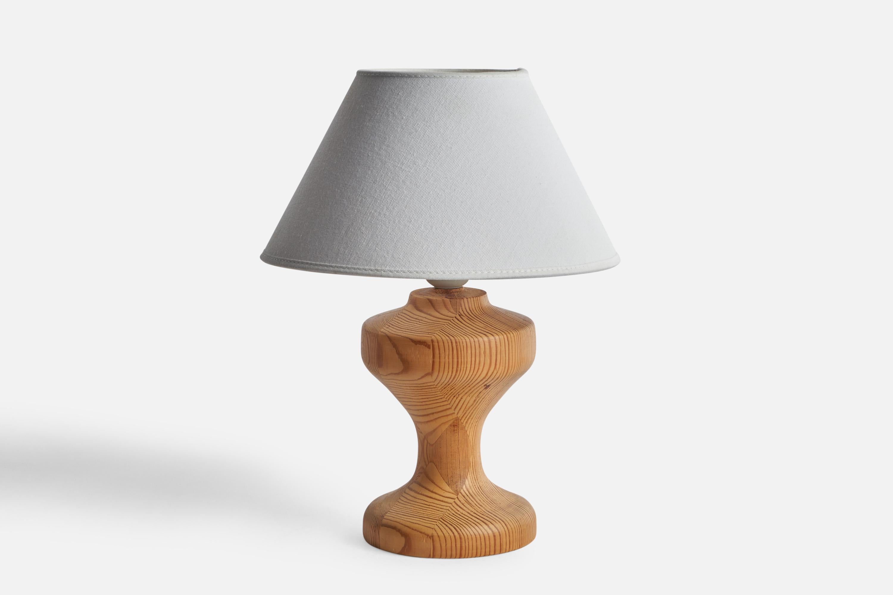 A pine table lamp designed and produced in Sweden, 1970s.

Dimensions of Lamp (inches): 9.3” H x 4.88” Diameter
Dimensions of Shade (inches): 4.5” Top Diameter x 10” Bottom Diameter x 5.25” H
Dimensions of Lamp with Shade (inches): 12.55” H x 10”