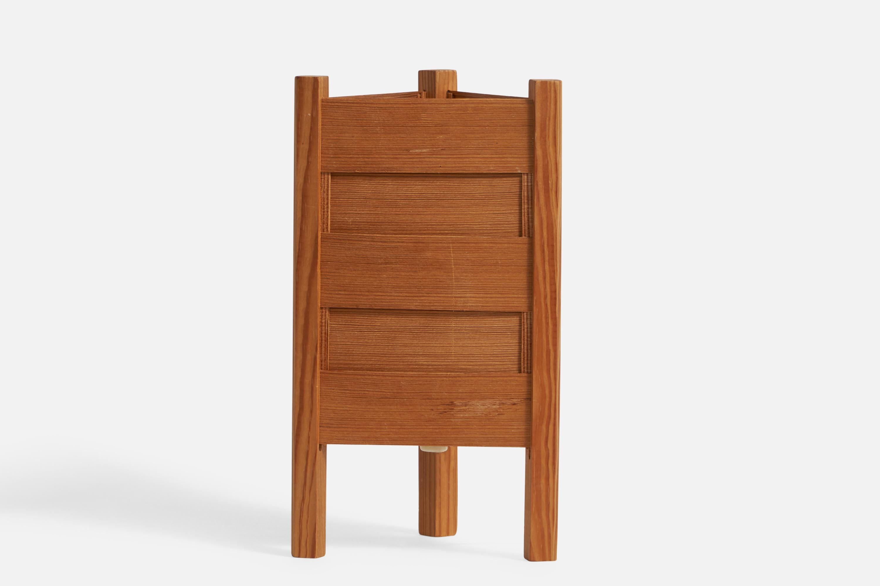 A pine and pine veneer table lamp designed and produced in Sweden, 1970s.

Overall Dimensions (inches): 10.45” H x 5.76” W x 5.25” D
Bulb Specifications: E-26 Bulb
Number of Sockets: 1
All lighting will be converted for US usage. We are unable to