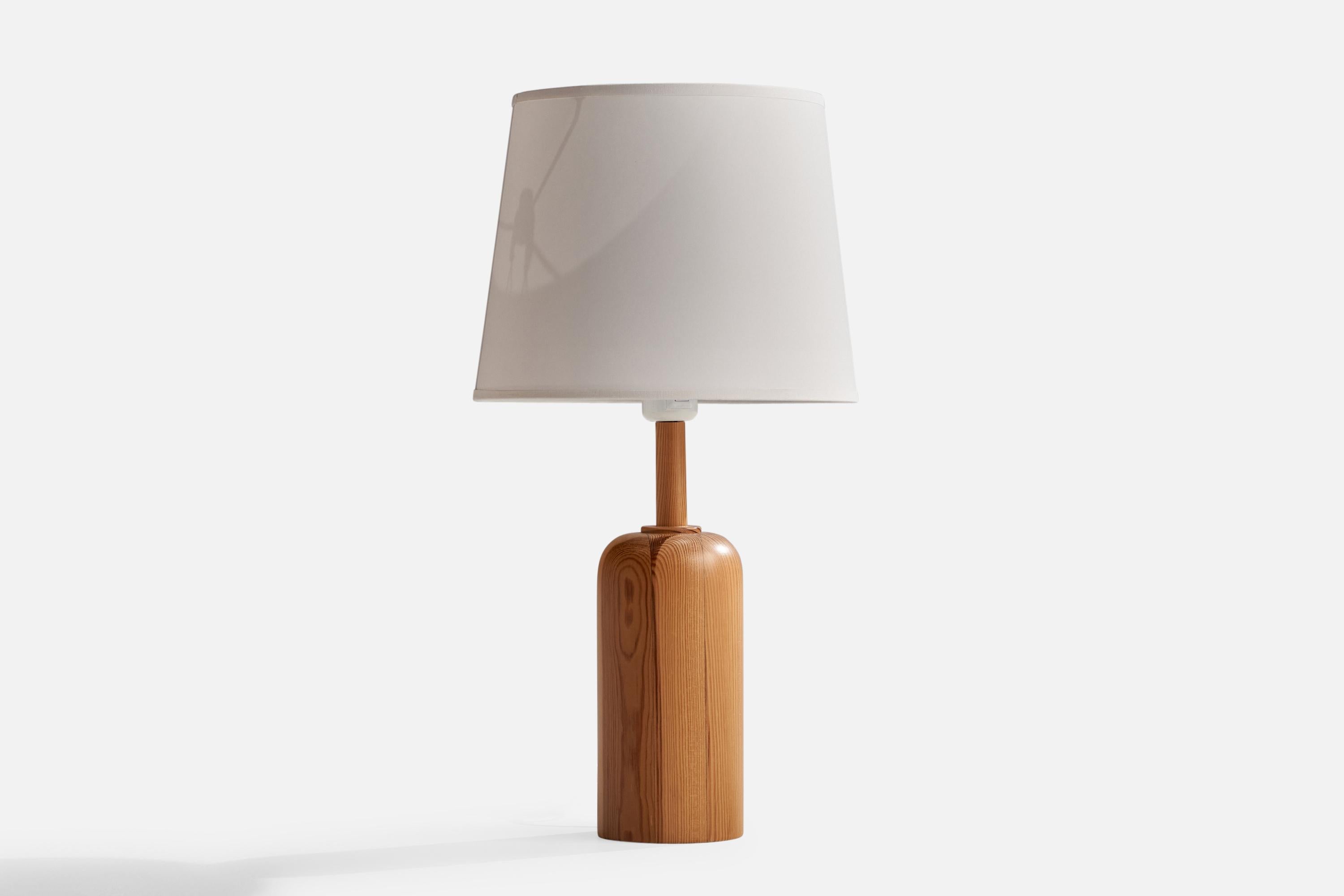 
A pine table lamp designed and produced in Sweden, 1970s.
Overall Dimensions (inches): 19.5”  H x 10”  W x 4”  D
Stated dimensions include shade.
Bulb Specifications: E-26 Bulb
Number of Sockets: 1
All lighting will be converted for US usage. We is