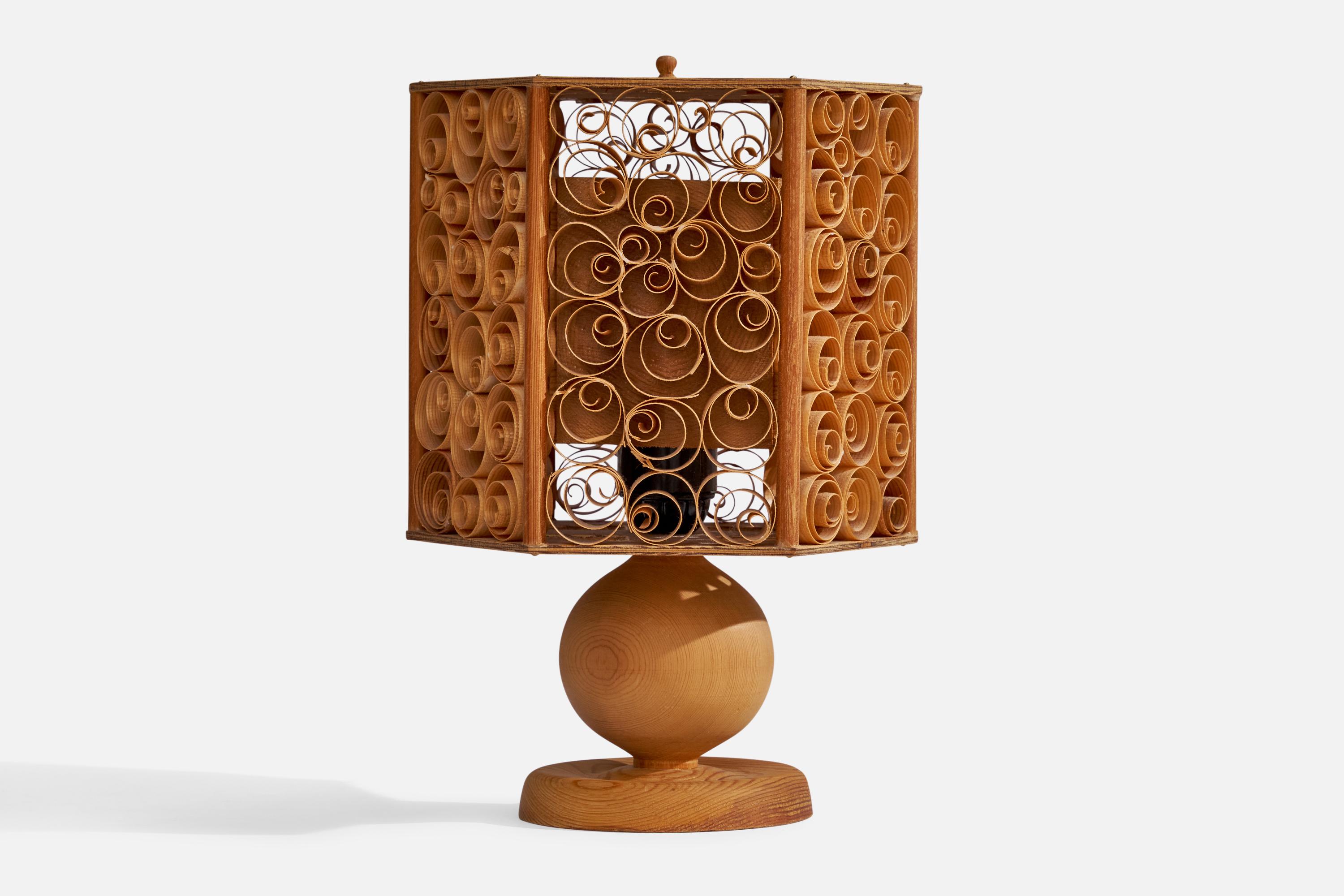 A pine and pine veneer table table lamp designed and produced in Sweden, 1970s.

Overall Dimensions (inches): 11.25”  H x 7”  W x 7”  D
Stated dimensions include shade.
Bulb Specifications: E-26 Bulb
Number of Sockets: 1
All lighting will be