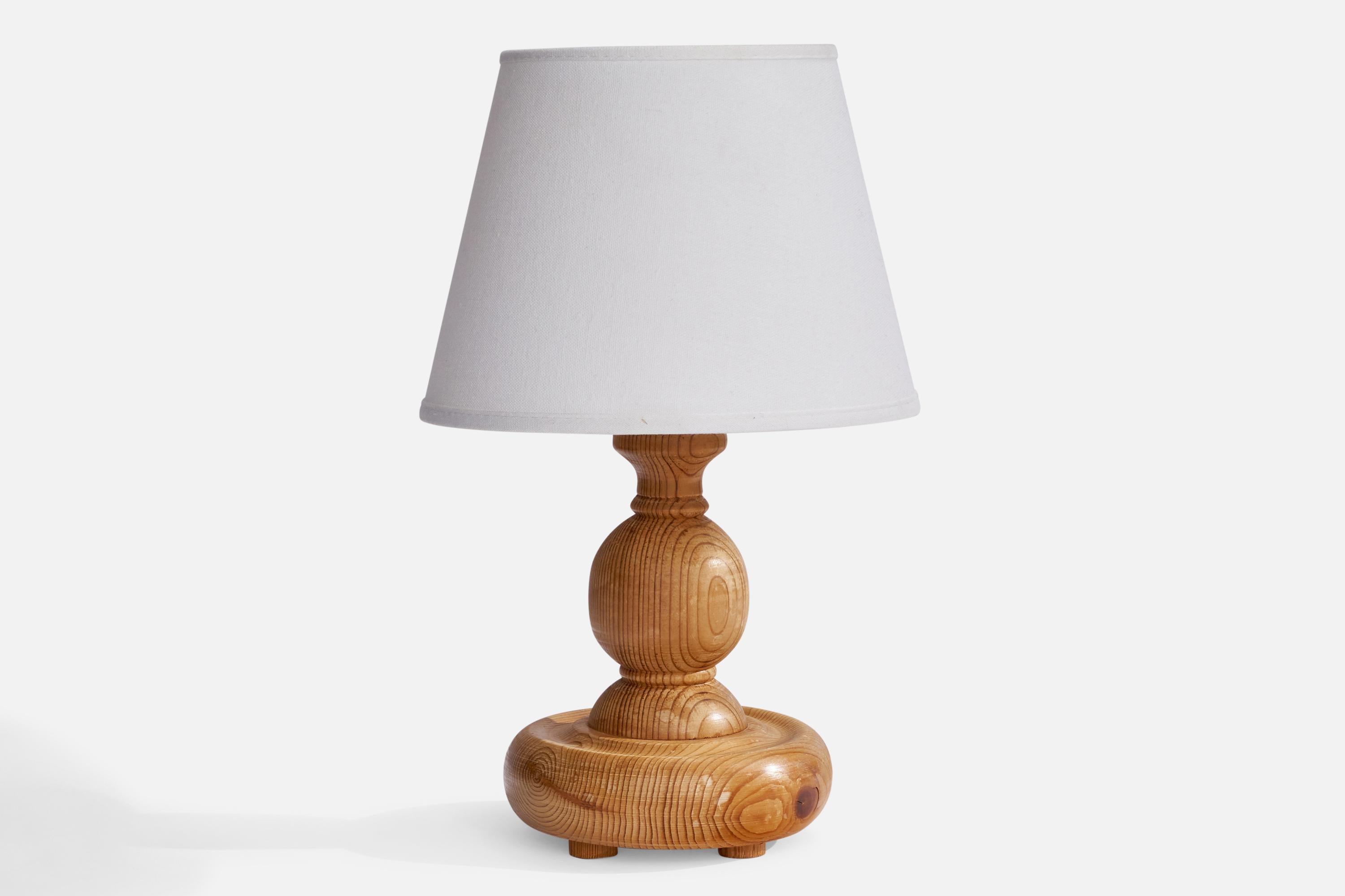 A pine table lamp designed and produced in Sweden, 1970s.

Dimensions of Lamp (inches): 9.75” H x 5.25” Diameter
Dimensions of Shade (inches): 5.25” Top Diameter x 8” Bottom Diameter x 5.75” H
Dimensions of Lamp with Shade (inches): 12.75” H x 8”