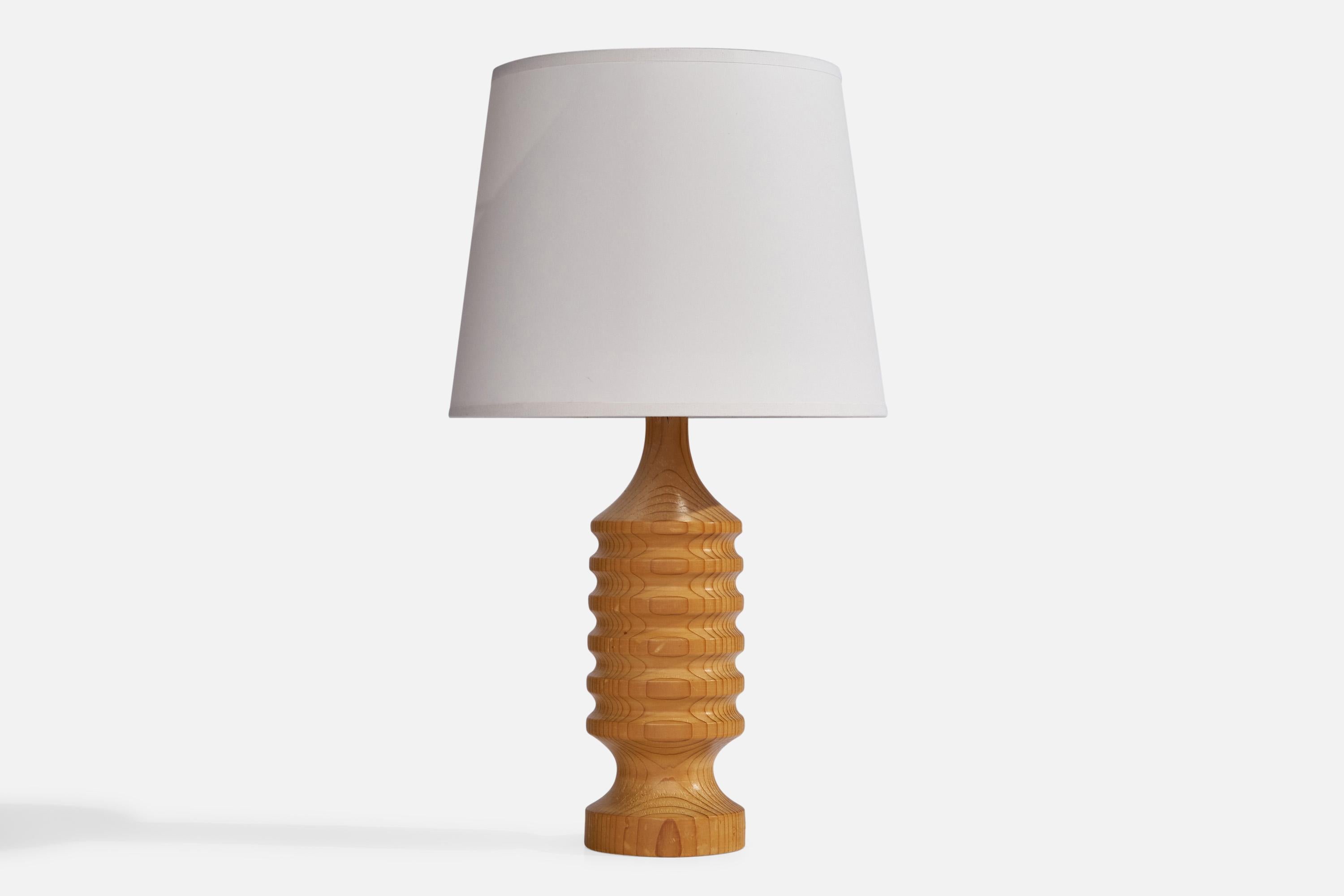 A pine table lamp designed and produced in Sweden, 1970s.

Dimensions of Lamp (inches): 12” H x 3.75” Diameter
Dimensions of Shade (inches): 8” Top Diameter x 10” Bottom Diameter x 8” H
Dimensions of Lamp with Shade (inches): 17.75” H x 10”