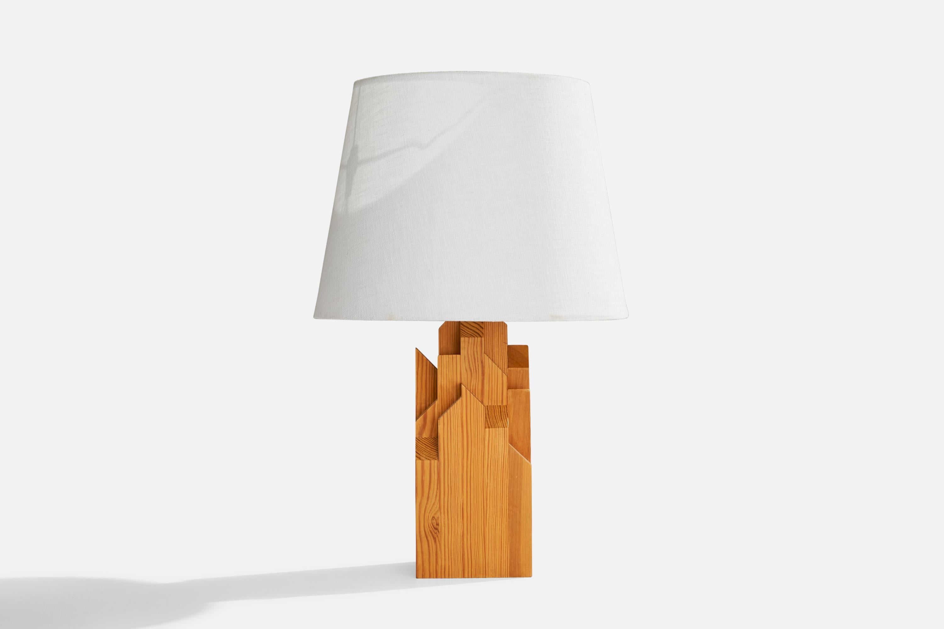 A pine table lamp designed and produced in Sweden, 1970s.

Dimensions of Lamp (inches): 13.25” H x 4.25” Diameter
Dimensions of Shade (inches): 9” Top Diameter x 12” Bottom Diameter x 9” H
Dimensions of Lamp with Shade (inches): 18.75”  H x
