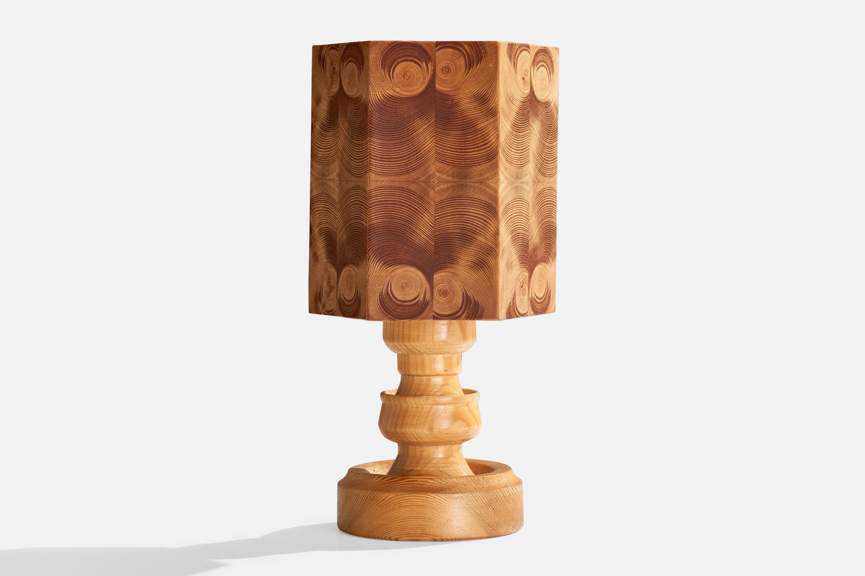 A pine table lamp designed and produced in Sweden, c. 1970s.

Dimensions of Lamp (inches): 15.5” H x 4.75” W x 4.75” D

Dimensions of Shade (inches): 6.25” Top Diameter x 6.25” Bottom Diameter x 6.875” H

Dimensions of Lamp with Shade (inches):
