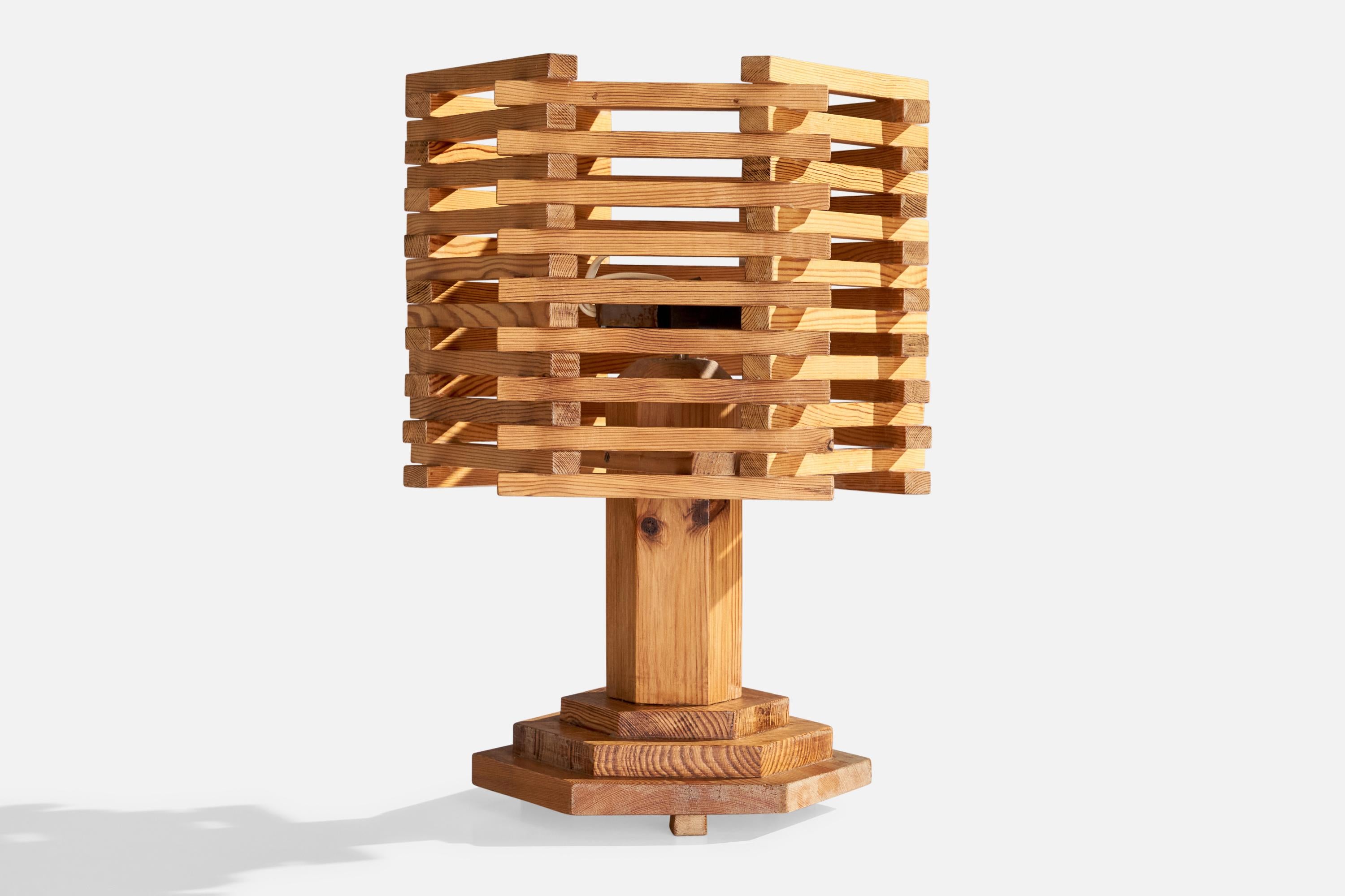 A pine table lamp designed and produced in Sweden, c. 1970s.

Dimensions of Lamp (inches): 11.75” H x 10.5” W x 10.5” D

Dimensions of Shade (inches): 13” Top Diameter x 13” Bottom Diameter x 10.375” H

Dimensions of Lamp with Shade (inches): 18.5”