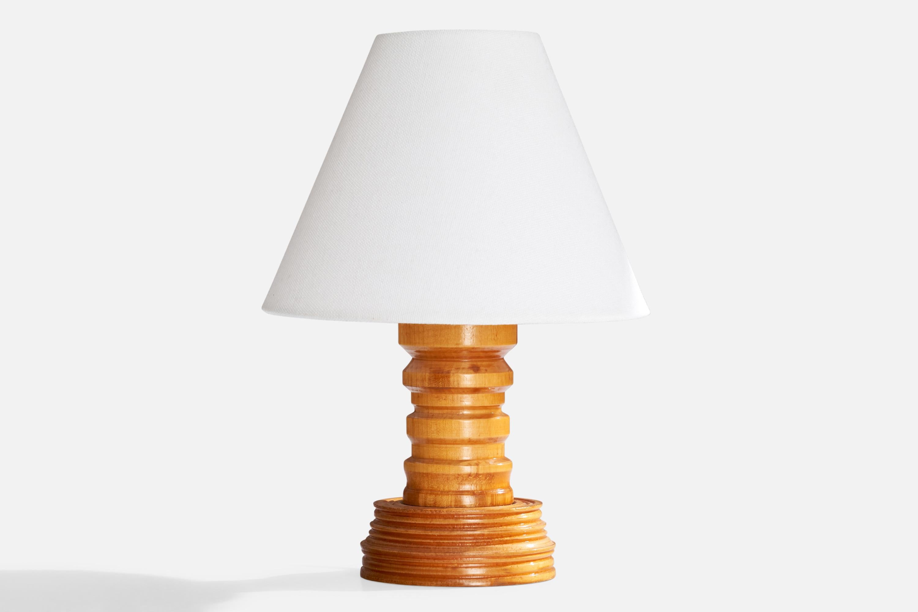 A pine table lamp designed and produced in Sweden, c. 1970s.

Dimensions of Lamp with Shade (inches): 9.875“ H x 7“ Diameter

Bulb Specifications: E-26 

Number of Sockets (per fixture): 1

Sold with lampshade.

All lighting will be converted for US