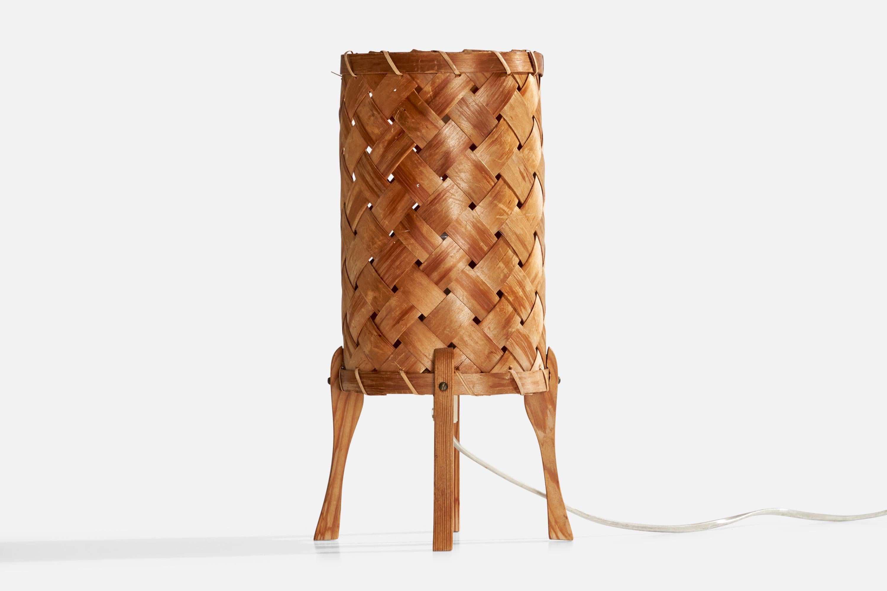 A pine and braided pine veneer table lamp designed and produced in Sweden, c. 1970s.

Dimensions of Lamp with Shade (inches): 11.5“ H x 6.25“ Diameter

Bulb Specifications: E-14

Number of Sockets (per fixture): 1

All lighting will be converted for
