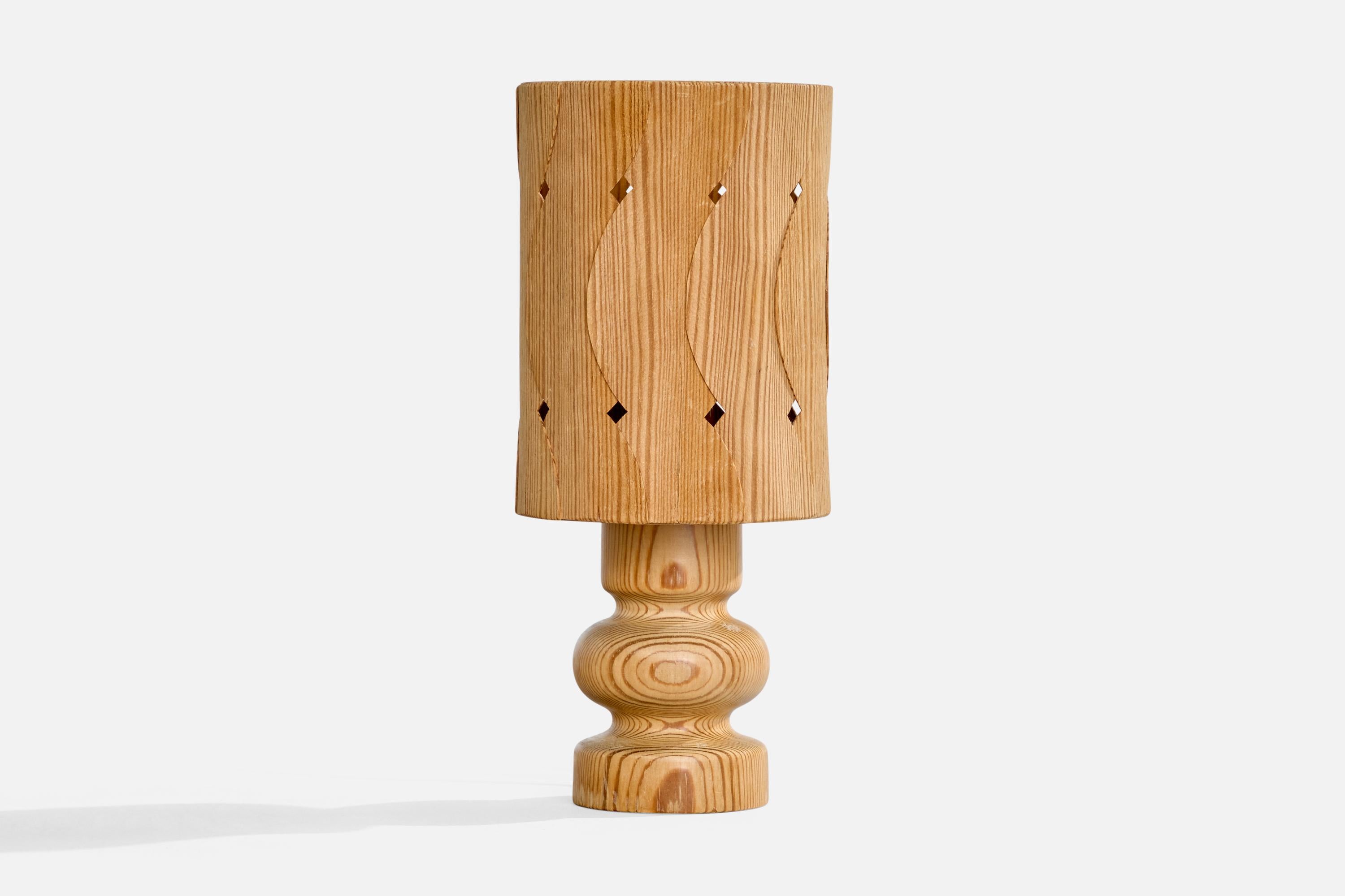 A pine table lamp designed and produced in Sweden, c. 1970s.

Dimensions of Lamp with Shade (inches): 9.3“ H x 4.125“ Diameter

Bulb Specifications: E-14

Number of Sockets (per fixture): 1

All lighting will be converted for US usage. We are unable