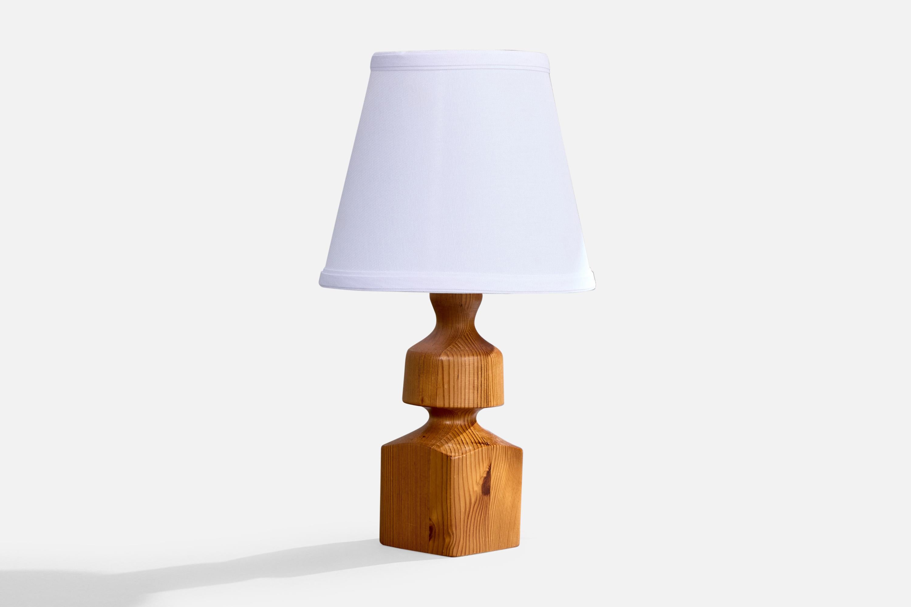 A table lamp designed and produced in Sweden, 1970s.

Dimensions of Lamp (inches): 10.25” H x 3.1” W x 3.1” D

Dimensions of Shade (inches): 5” Top Diameter x 8” Bottom Diameter x 7” H 

Dimensions of Lamp with Shade (inches): 13.9” H x 8”