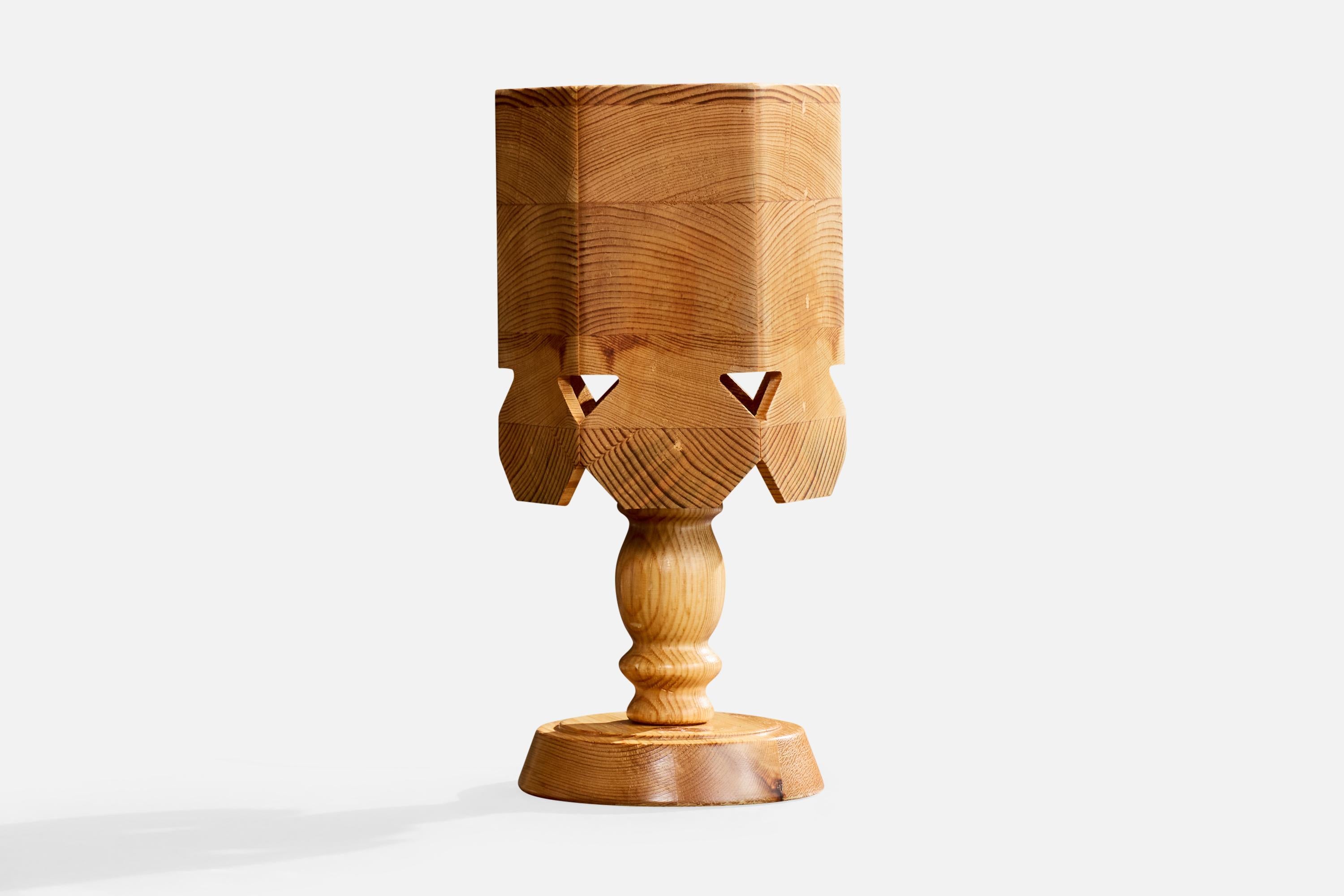 A pine table lamp designed and produced in Sweden, c. 1970s.

Dimensions of Lamp (inches): 10.55