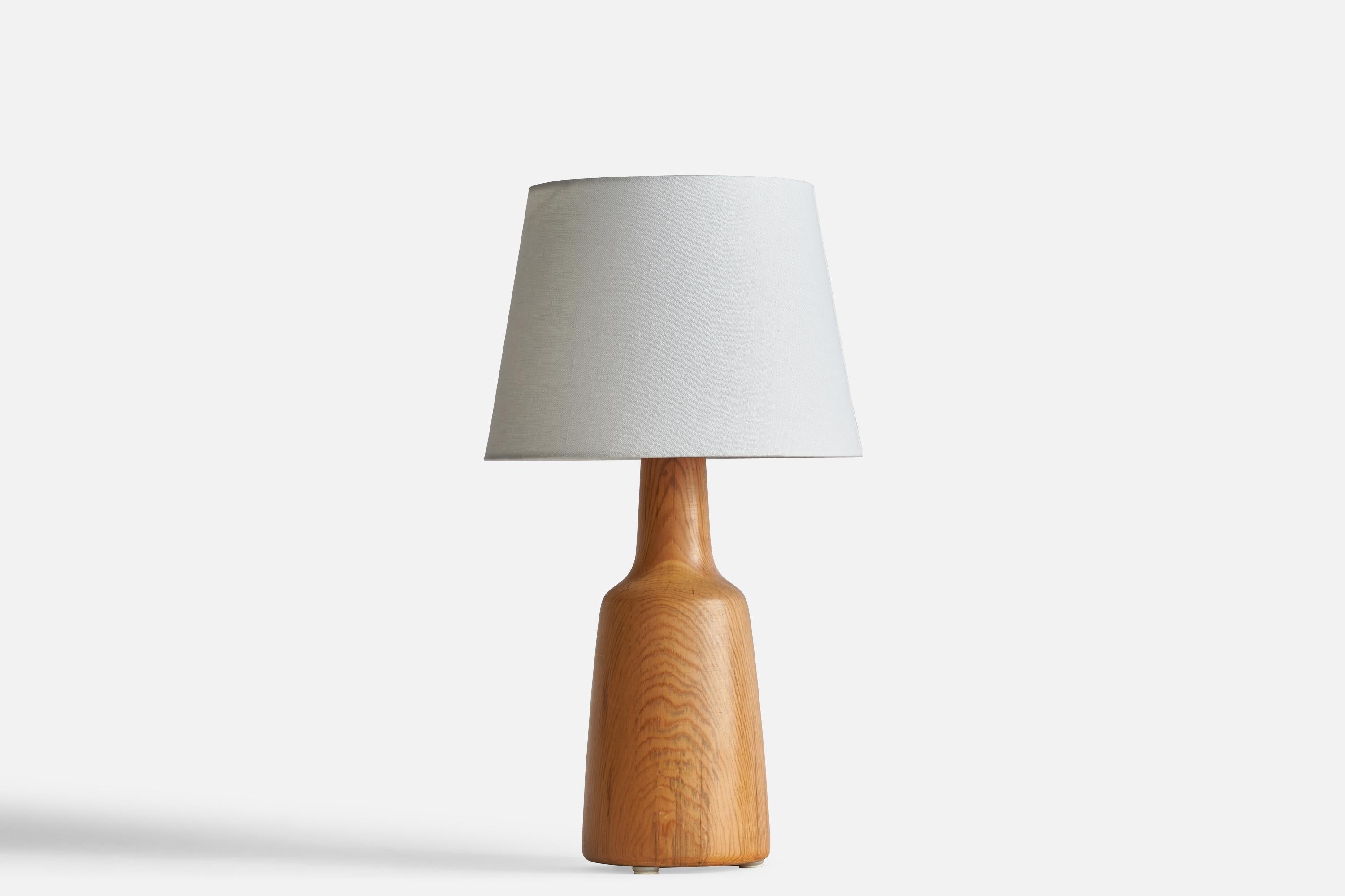 A pine table lamp designed and produced in Sweden, 1977.

Dimensions of Lamp (inches): 15.25” x 6.22” Diameter
Dimensions of Shade (inches): 9” Top Diameter x 12” Bottom Diameter x 9” H
Dimensions of Lamp with Shade (inches): 19.75” H x 12”