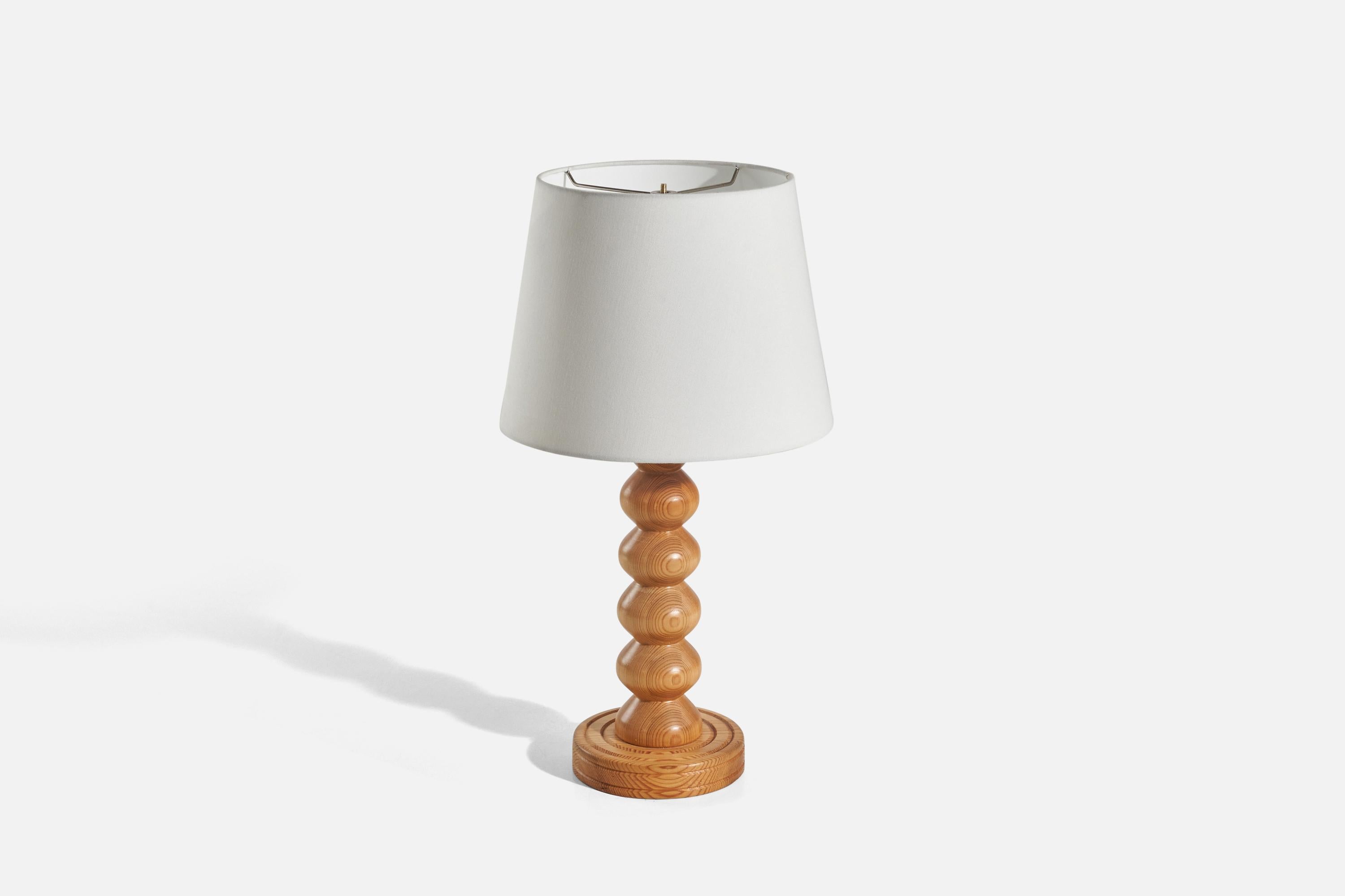 A pine table lamp designed and produced in Sweden, 1978.

Sold without Lampshade(s)
Dimensions of Lamp (inches) : 16.37 x 6.43 x 6.43 (Height x Width x Depth)
Dimensions of Shade (inches) : 9 x 12 x 9 (Top Diameter x Bottom Diameter x