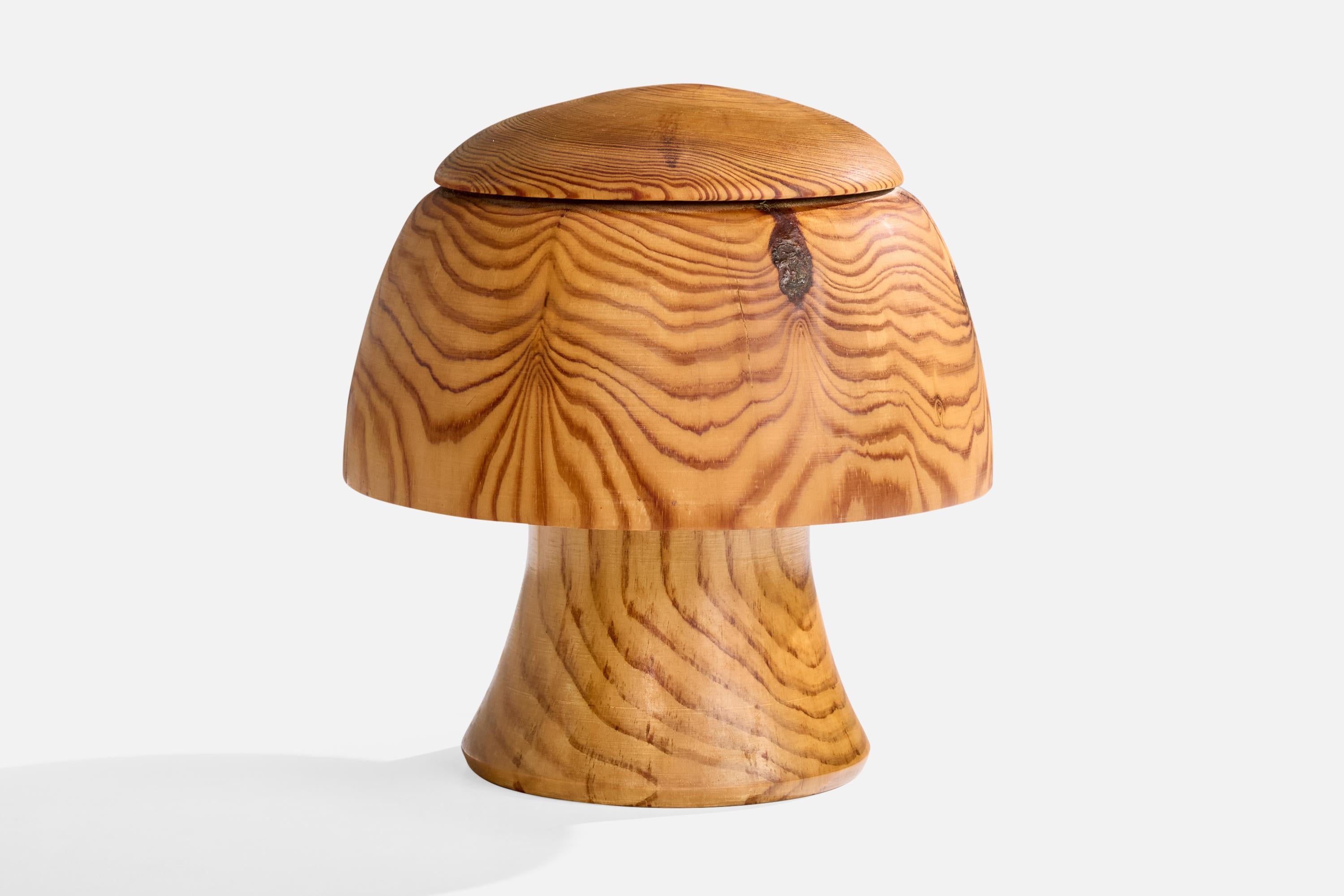 A pine table lamp designed and produced in Sweden, initialed and dated 1997.

Dimensions of Lamp (inches): 10.5