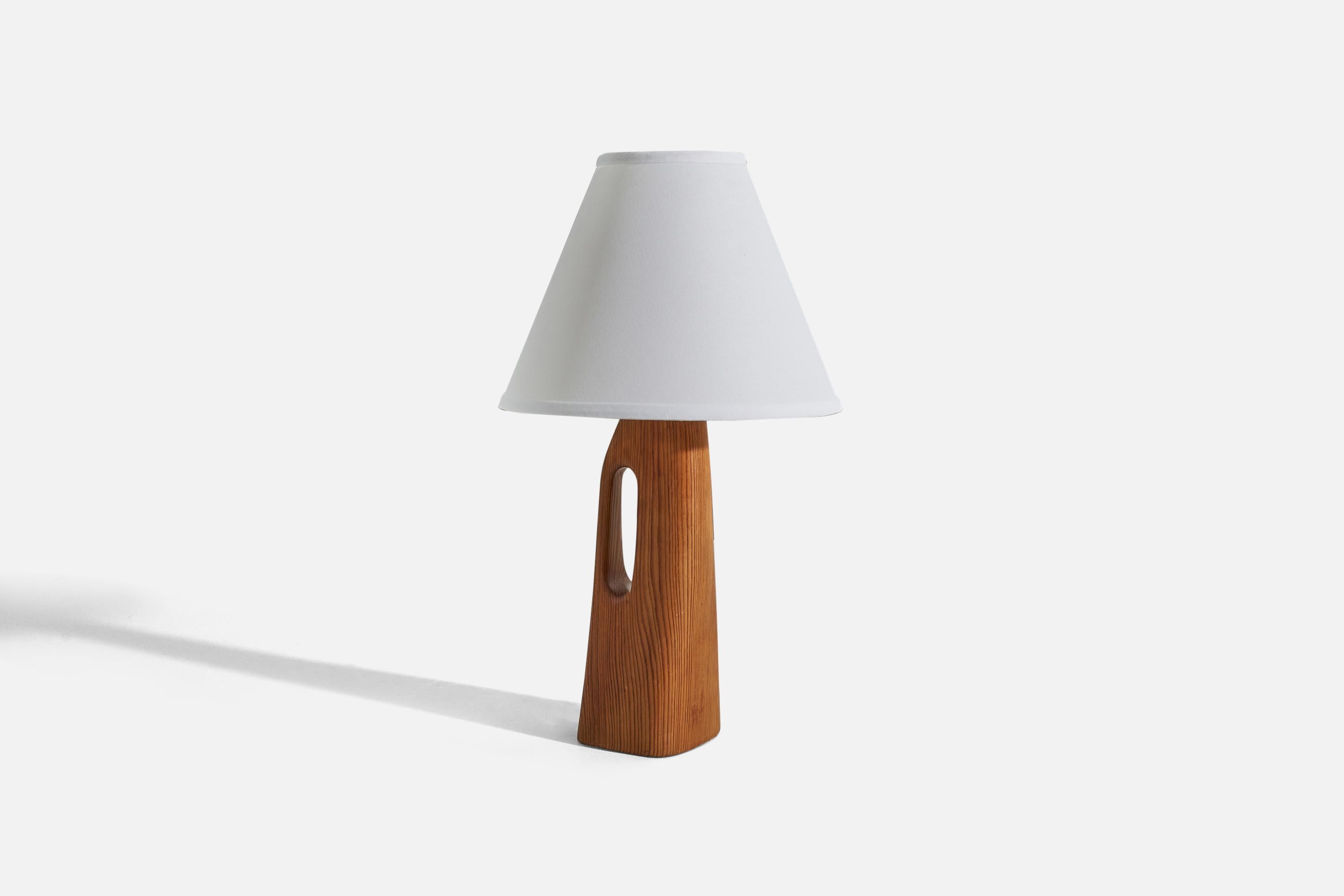 A pine table lamp designed and produced in Sweden, c. 1960s. 

Sold without lampshade. 
Dimensions of lamp (inches) : 12.87 x 3.87 x 3.75 (H x W x D)
Dimensions of shade (inches) : 4.25 x 10.25 x 8 (T x B x S)
Dimension of lamp with shade