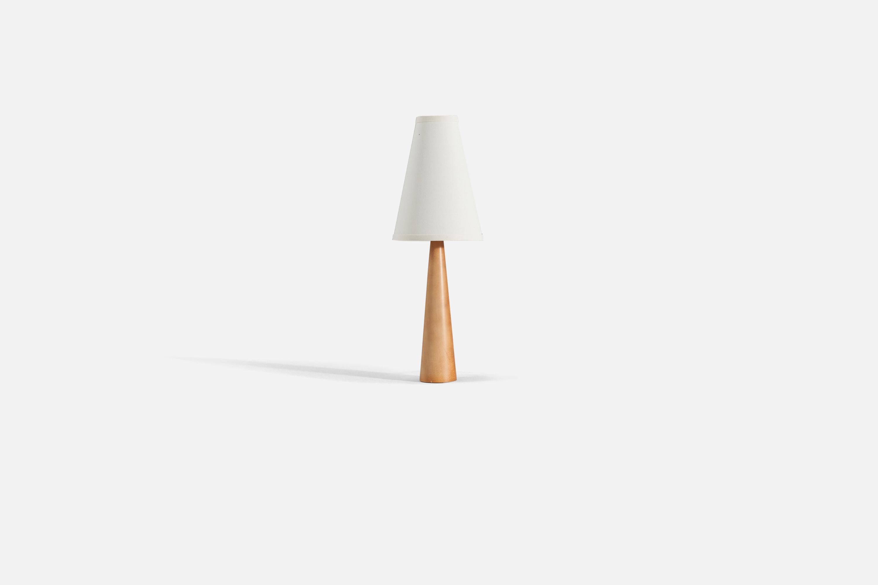 A turned solid wood table lamp designed and produced in Sweden, 1970s.

Lampshade not included. 

Measurements listed are of lamp only. 
For reference. 
Shade : 3.25 x 7.25 x 10
Lamp with shade : 21 x 7.25 x 7.25.