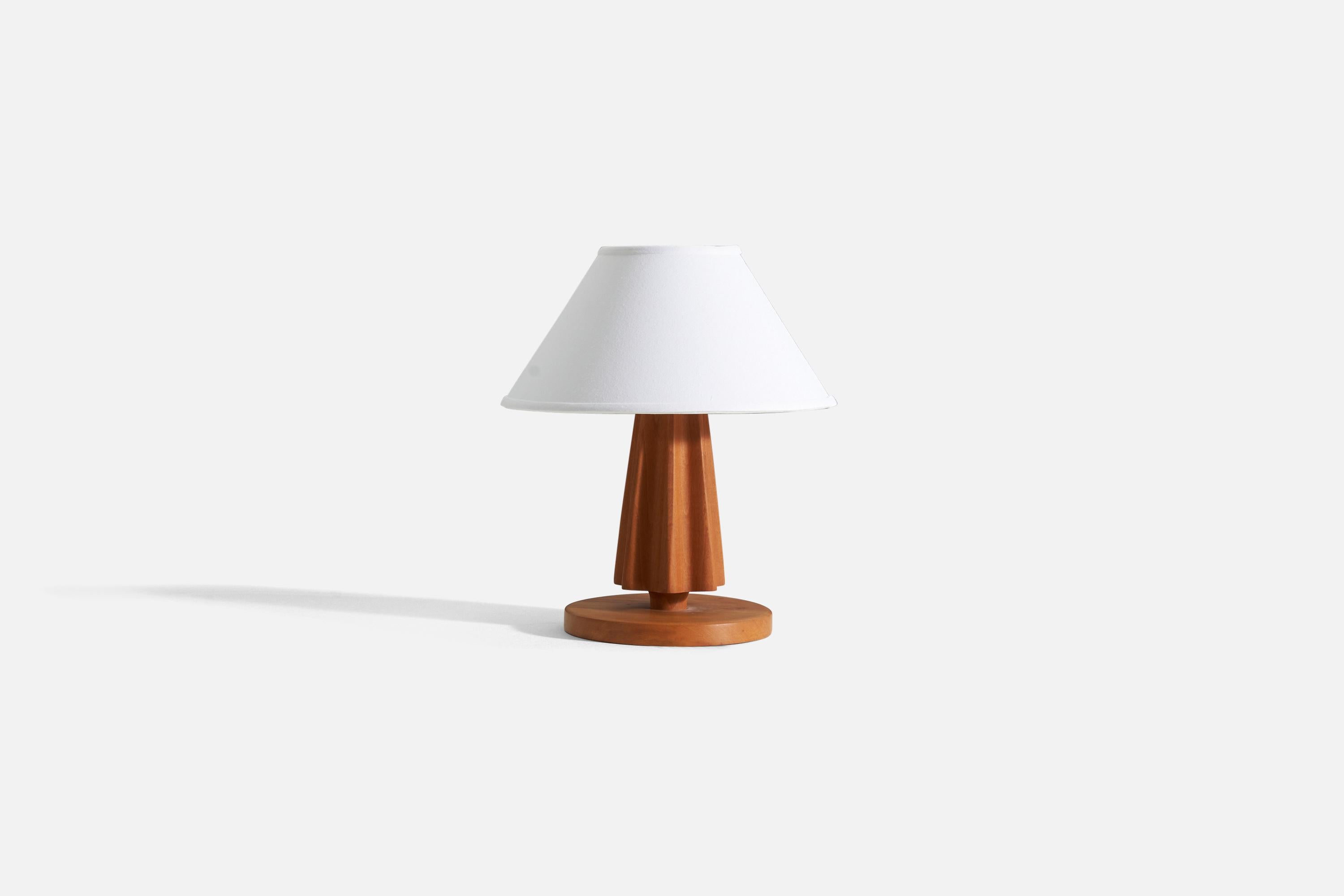 A solid wood table lamp, designed and produced in Sweden, c. 1960s. 

Sold without lampshade.

For reference:
Dimensions of lamp with shade: H 16.5” / W 14.5”
Dimensions of shade: top of shade diameter 6” / bottom of shade diameter 14.5” /