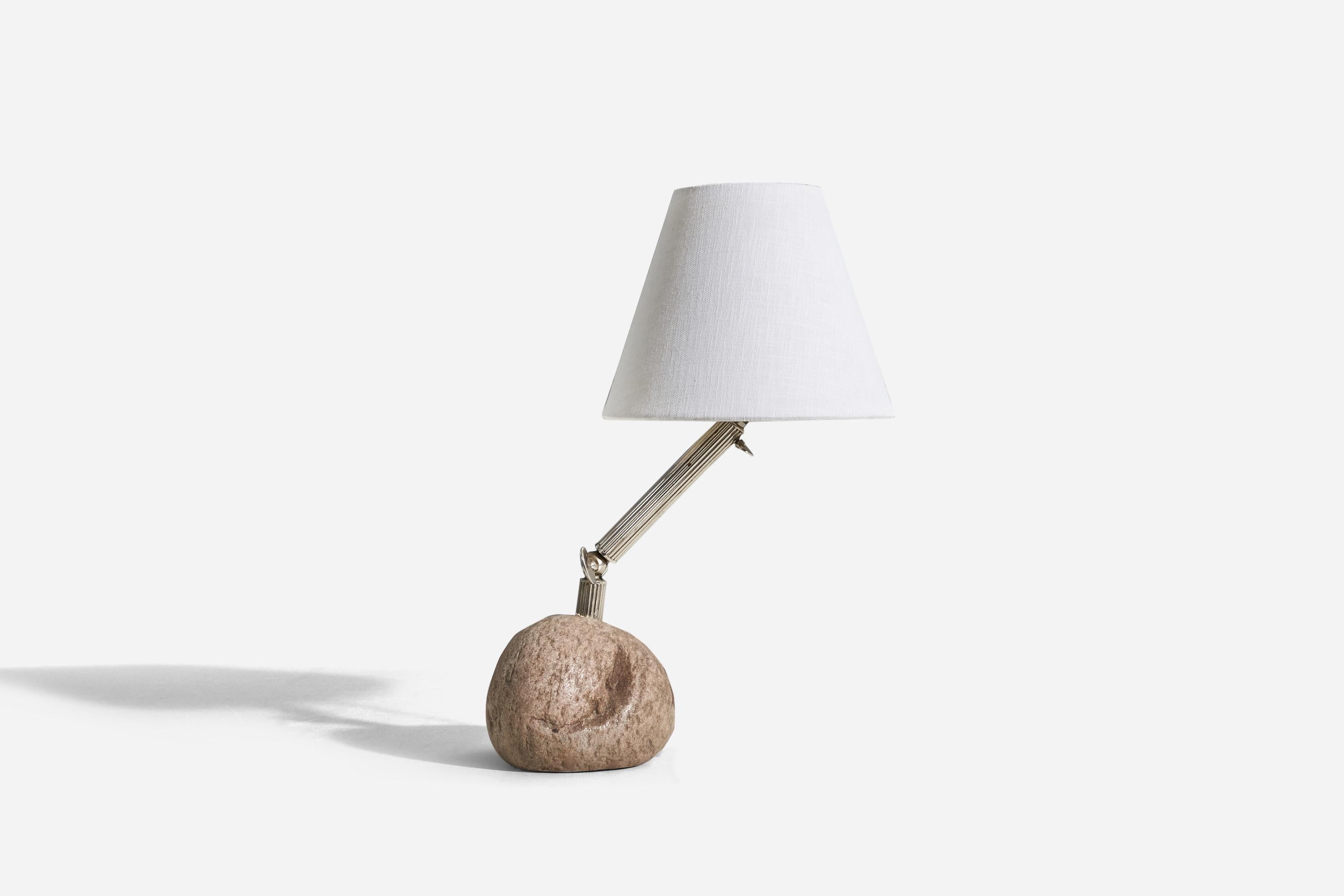 A stone and metal table lamp designed and produced in Sweden, c. 1970s.

Variable dimensions, measured as illustrated in the first image. Please note cord feeds directly from socket.

Sold without lampshade. 
Dimensions of lamp (inches) : 13.56