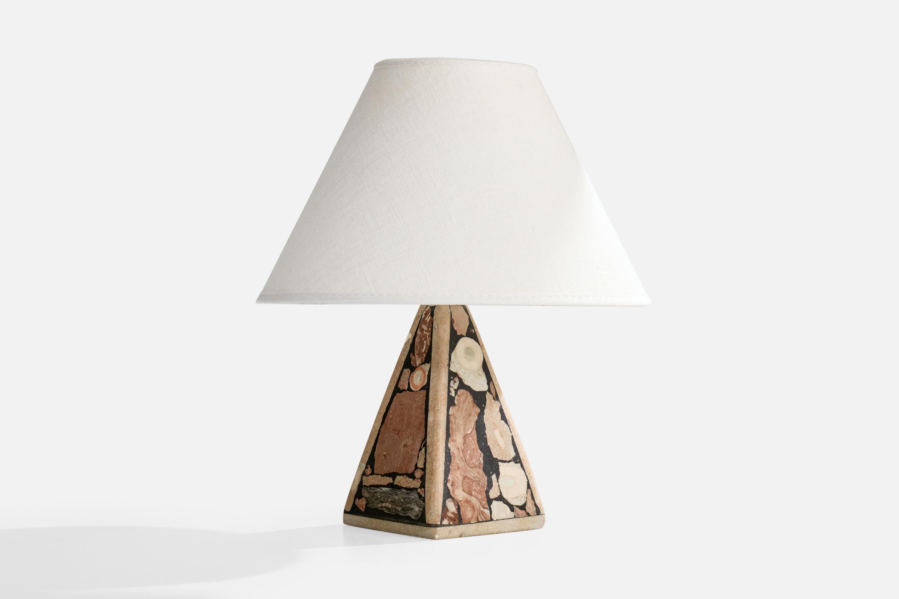 A fossil stone table lamp designed and produced in Sweden, c. 1990s.

Dimensions of Lamp (inches): 6.65