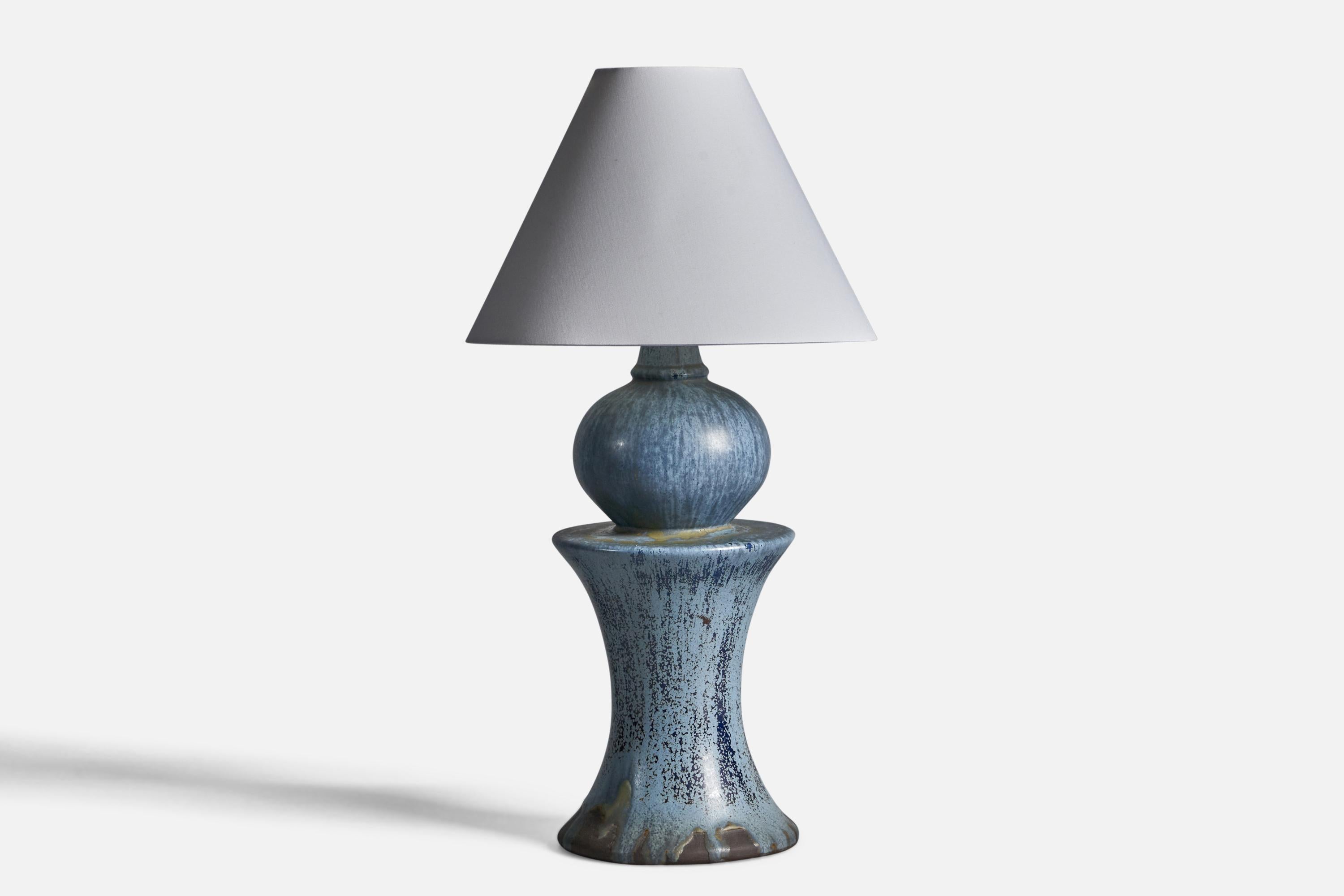 A blue-glazed stoneware table lamp designed and produced in Sweden, 1960s.

Dimensions of Lamp (inches): 15.5