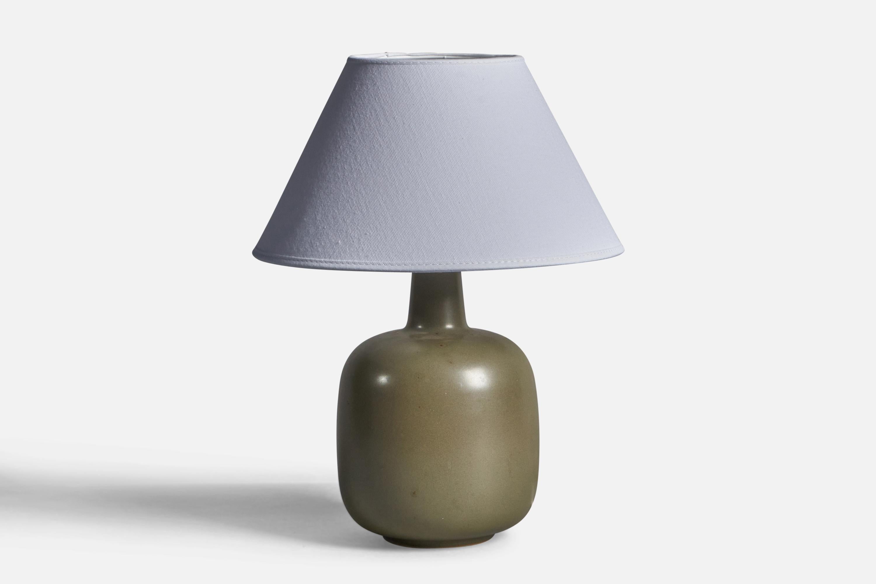 A green-glazed stoneware table lamp, designed and produced in Sweden, c. 1960s.

Dimensions of Lamp (inches): 10