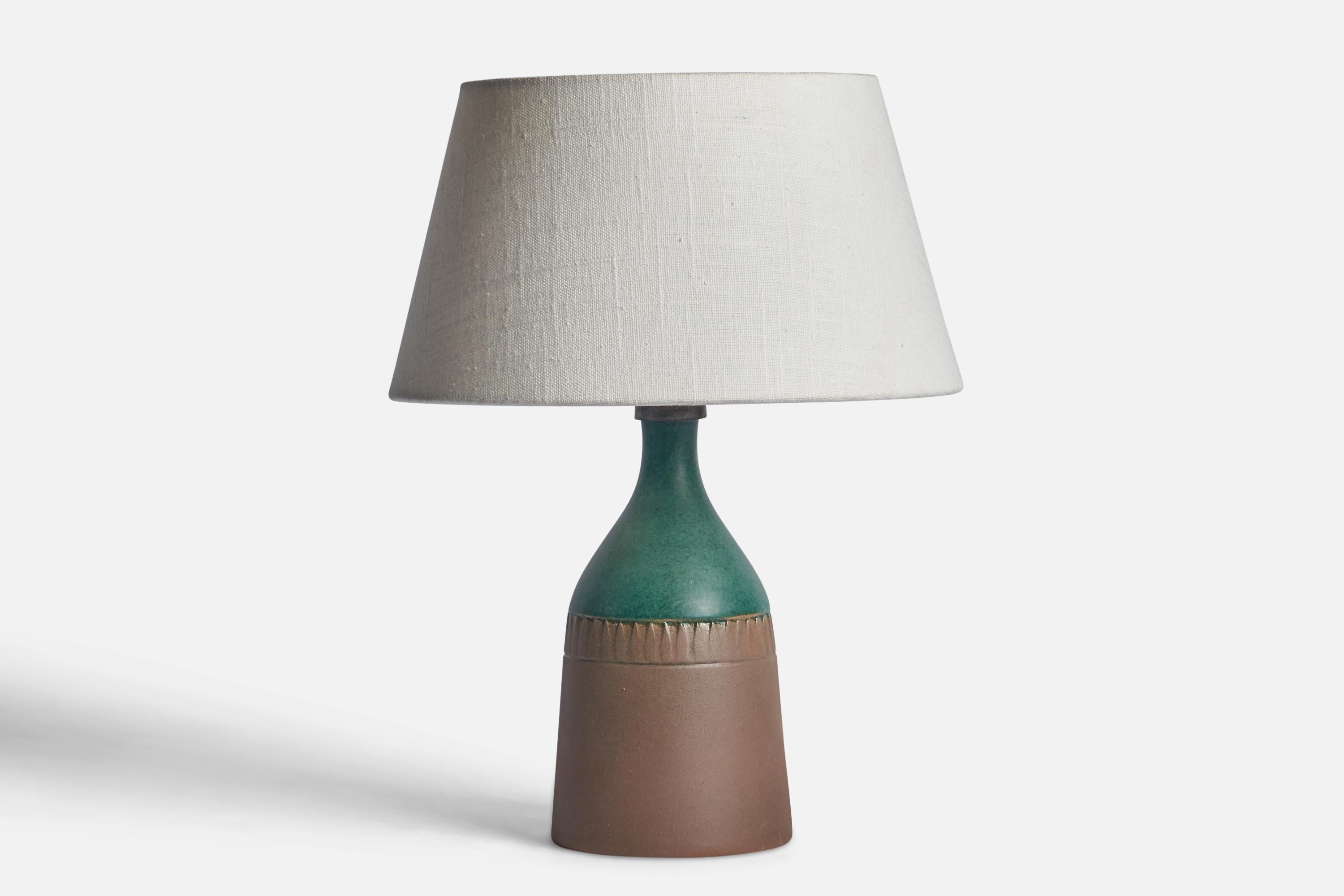 A green semi-glazed stoneware table lamp designed and produced in Sweden, c. 1960s.

Dimensions of Lamp (inches): 10.25