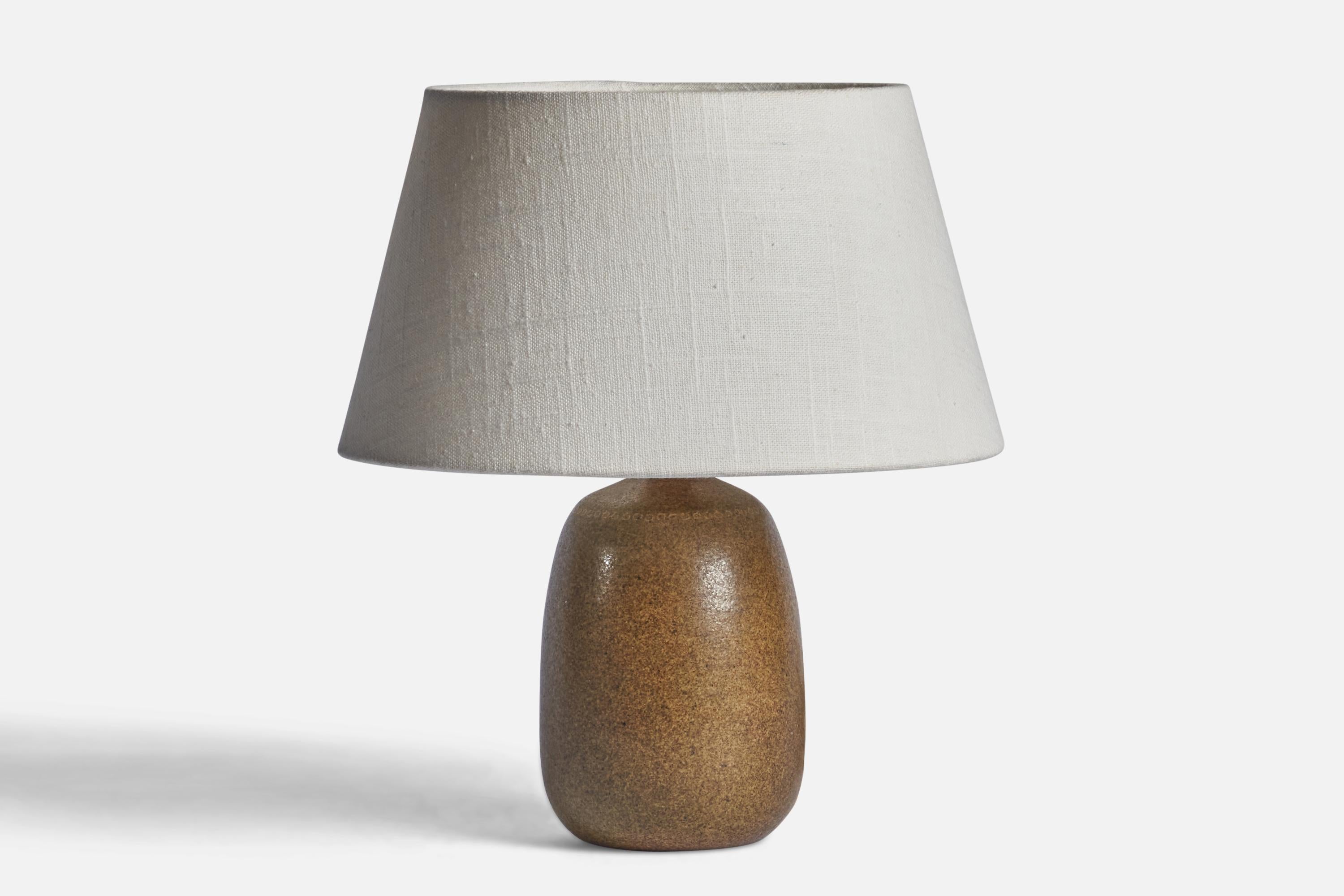 A brown-glazed stoneware table lamp designed and produced in Sweden, 1960s.

Dimensions of Lamp (inches): 8.5” H x 4” Diameter
Dimensions of Shade (inches): 7” Top Diameter x 10” Bottom Diameter x 5.5” H 
Dimensions of Lamp with Shade (inches):