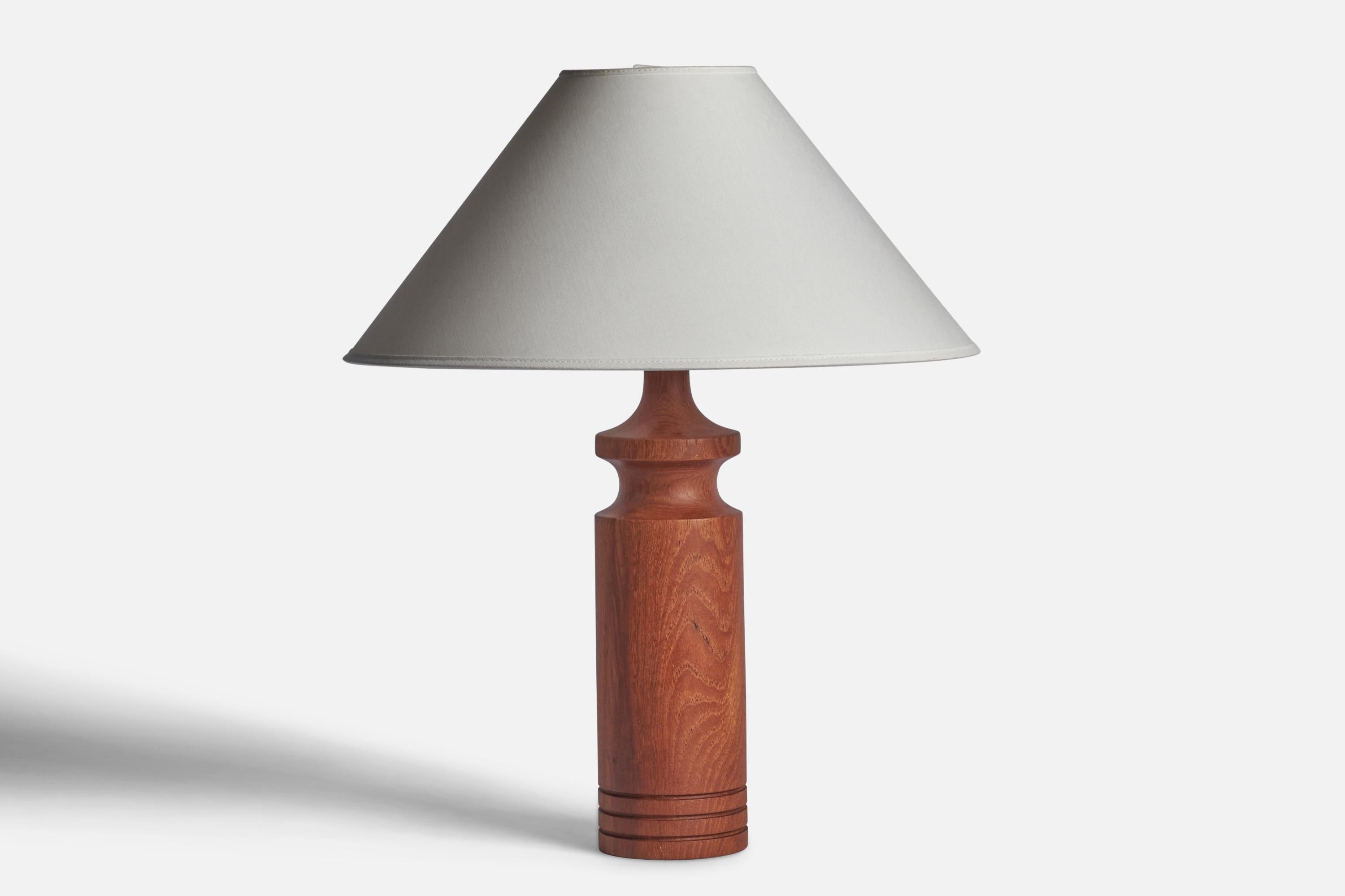 A teak table lamp designed and produced in Sweden, 1950s.

Dimensions of Lamp (inches): 14.75” H x 3.75” Diameter
Dimensions of Shade (inches): 4.5” Top Diameter x 16” Bottom Diameter x 7.25” H
Dimensions of Lamp with Shade (inches): 22.75” H x 16”