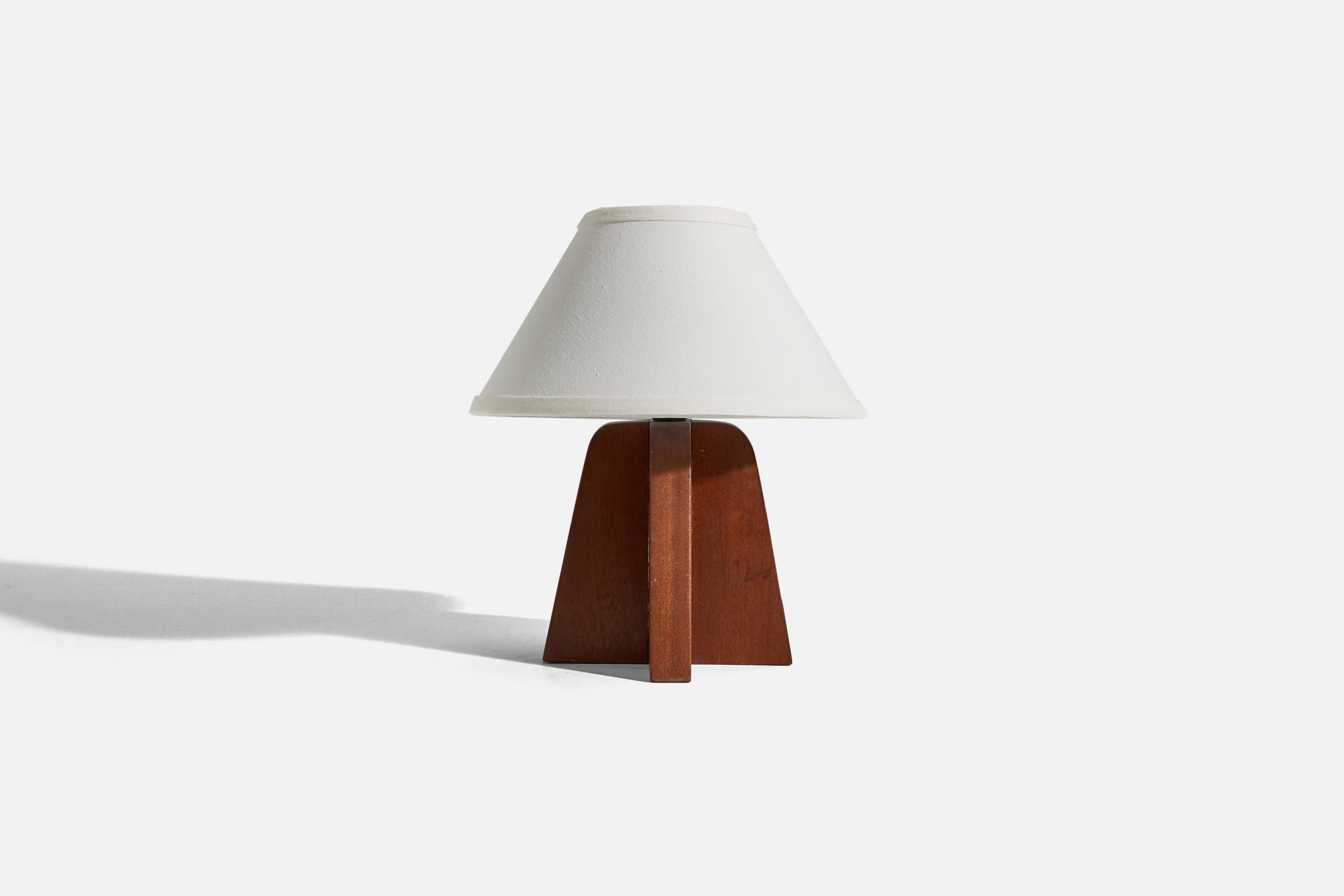 A teak table lamp designed and produced in Sweden, c. 1960s. 

Sold without lampshade. 
Dimensions of Lamp (inches) : 8.6875 x 6.5 x 7 (H x W x D)
Dimensions of Shade (inches) : 4.5 x 10.25 x 6 (T x B x H)
Dimension of Lamp with Shade (inches)