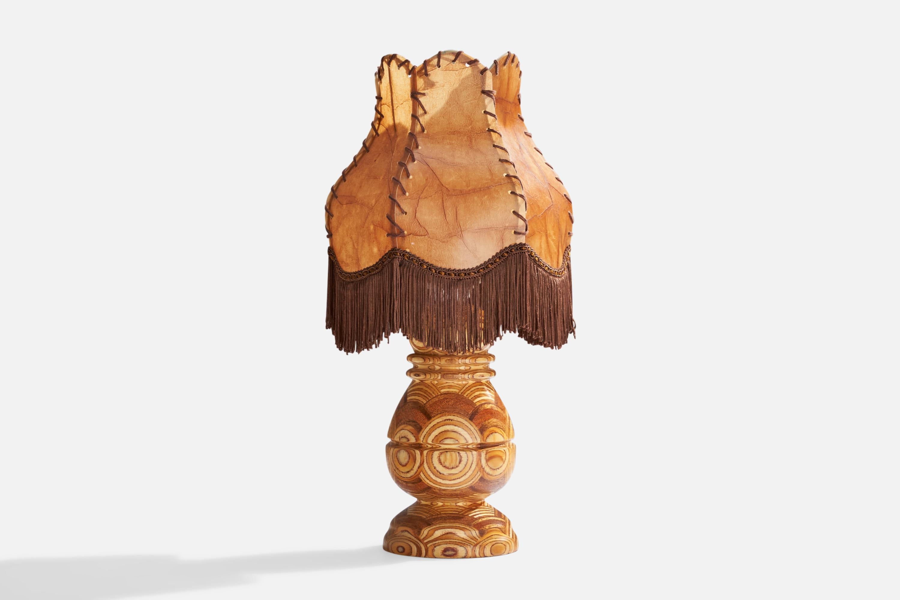 A laminated wood, brown fabric and beige parchment paper table lamp designed and produced in Sweden, c. 1950s.

Overall Dimensions (inches): 16”  H x 7.25” D
Stated dimensions include shade.
Bulb Specifications: E-26 Bulb
Number of Sockets: 1
All