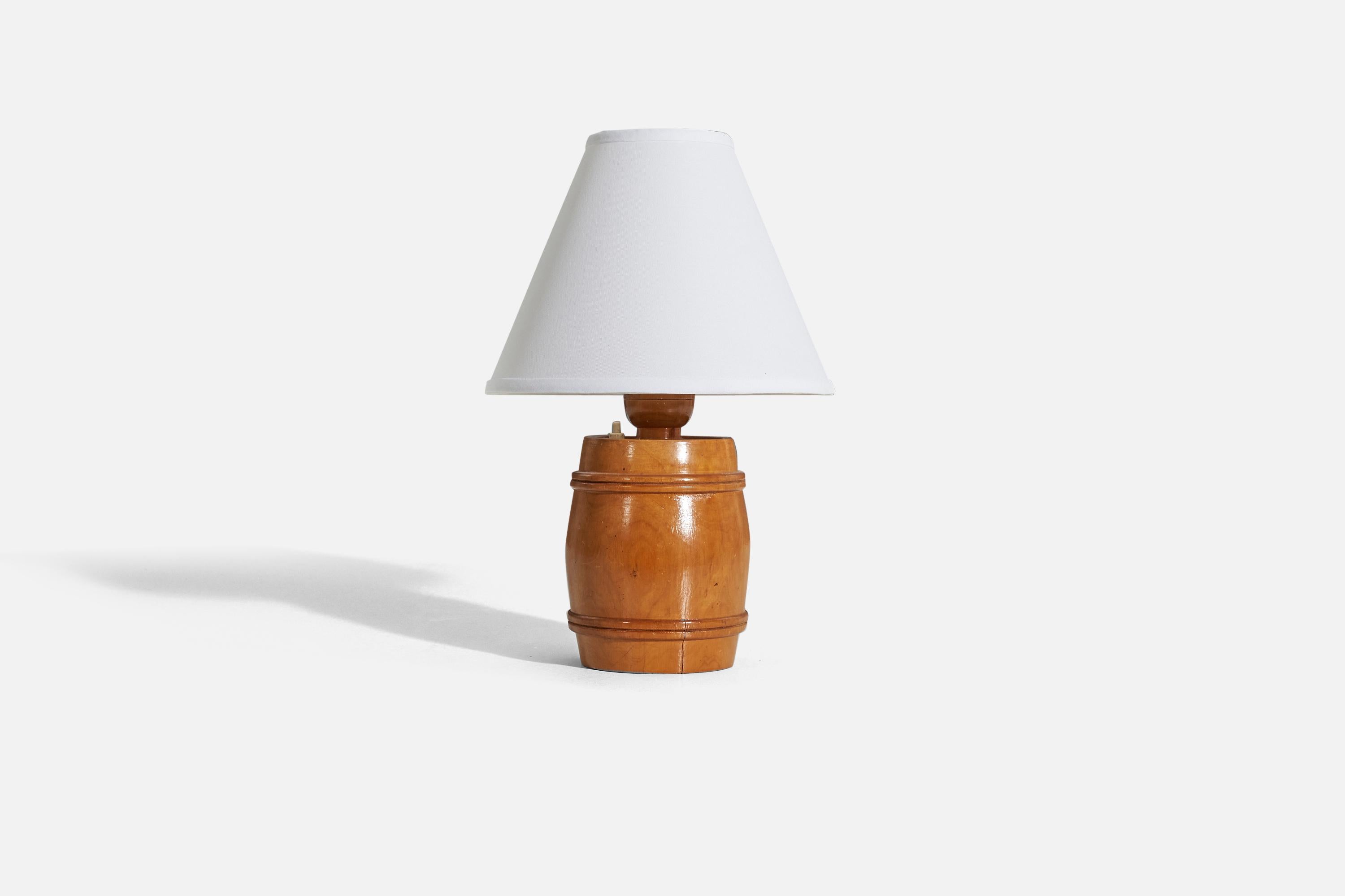 A wooden table lamp designed and produced in Sweden, 1950s. 

Sold without lampshade. 
Dimensions of Lamp (inches) : 11.375 x 6 x 6 (H x W x D)
Dimensions of Shade (inches) : 4 x 10 x 8 (T x B x H)
Dimension of Lamp with Shade (inches) : 15.375