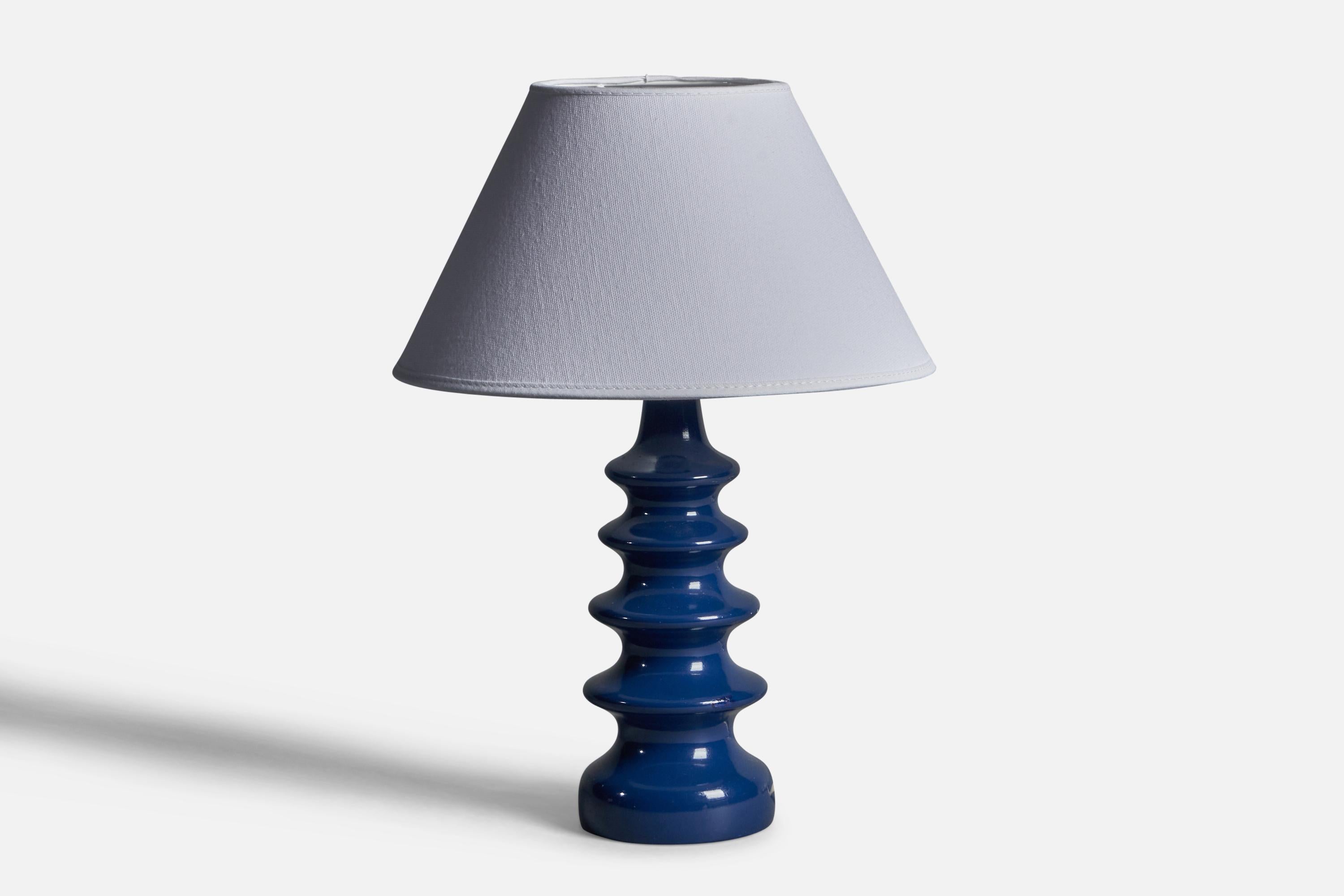 A blue-painted wood table lamp designed and produced in Sweden, 1960s.

Dimensions of Lamp (inches): 10.75