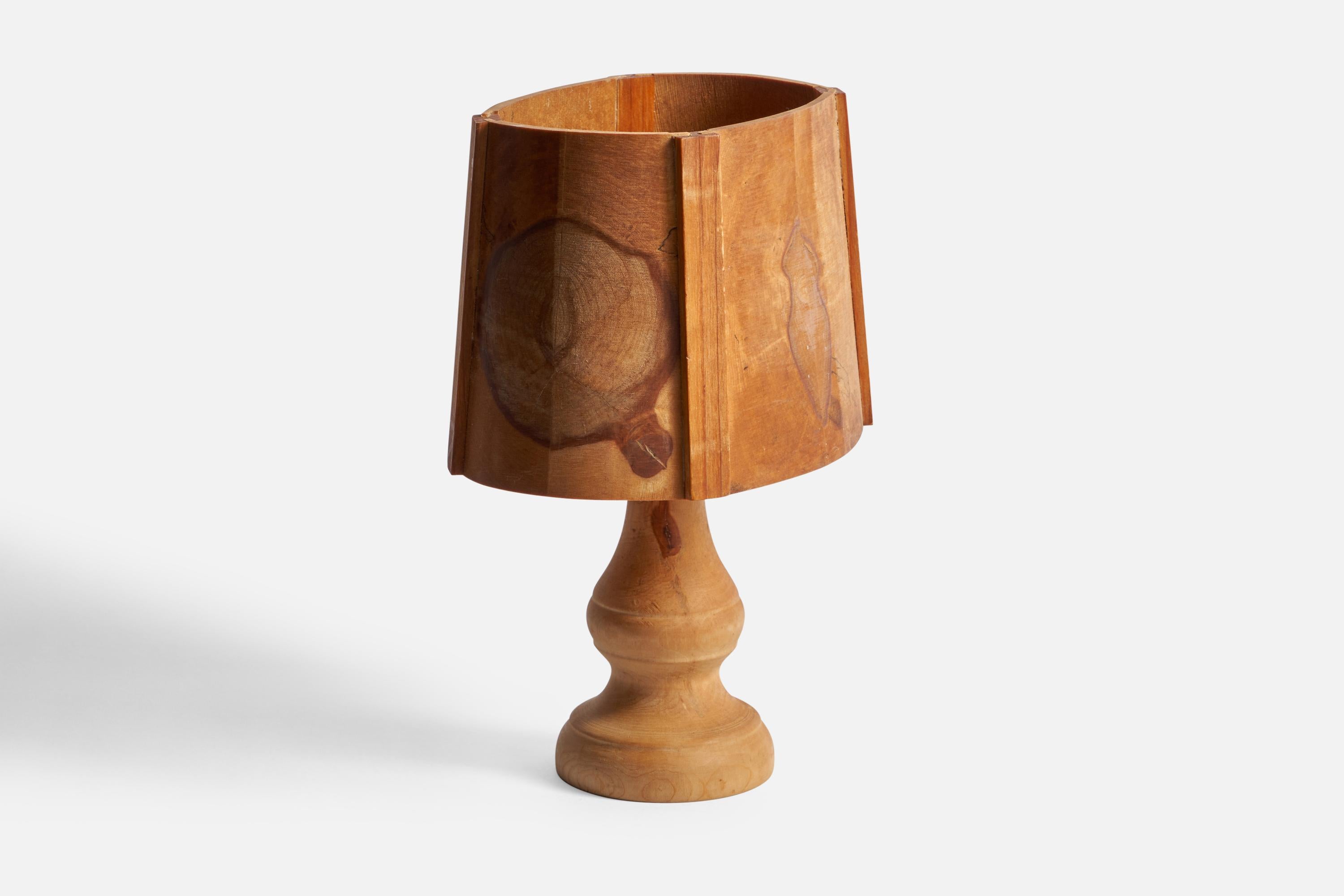 A wood table lamp designed and produced in Sweden, 1970s.

Overall Dimensions (inches): 11.25” H x 8.25” W x 6.25” D
Bulb Specifications: E-26 Bulb
Number of Sockets: 1
All lighting will be converted for US usage. We are unable to confirm that any