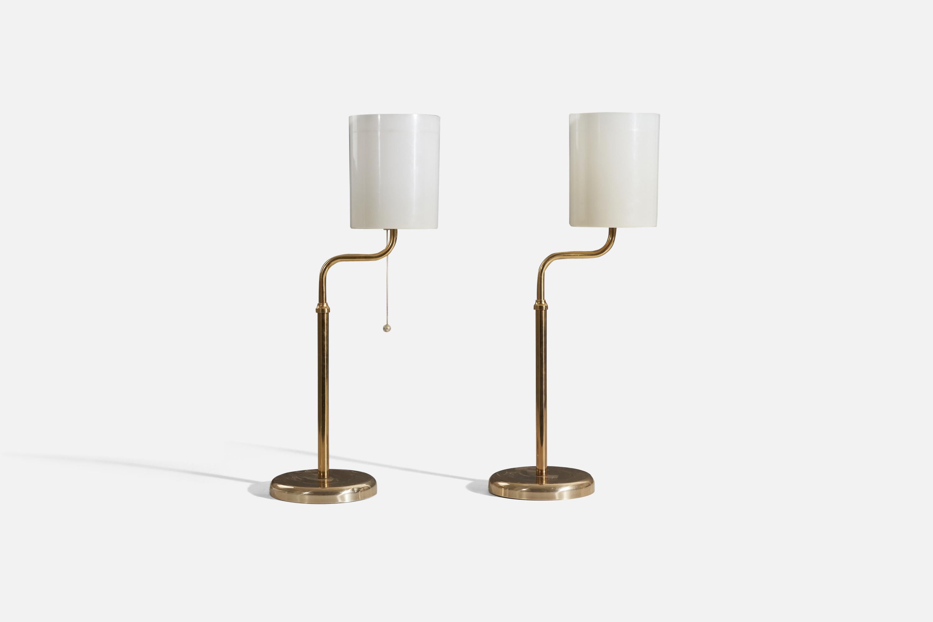 A pair of brass and acrylic table lamps designed and produced by a Swedish designer, Sweden, 1960s.



