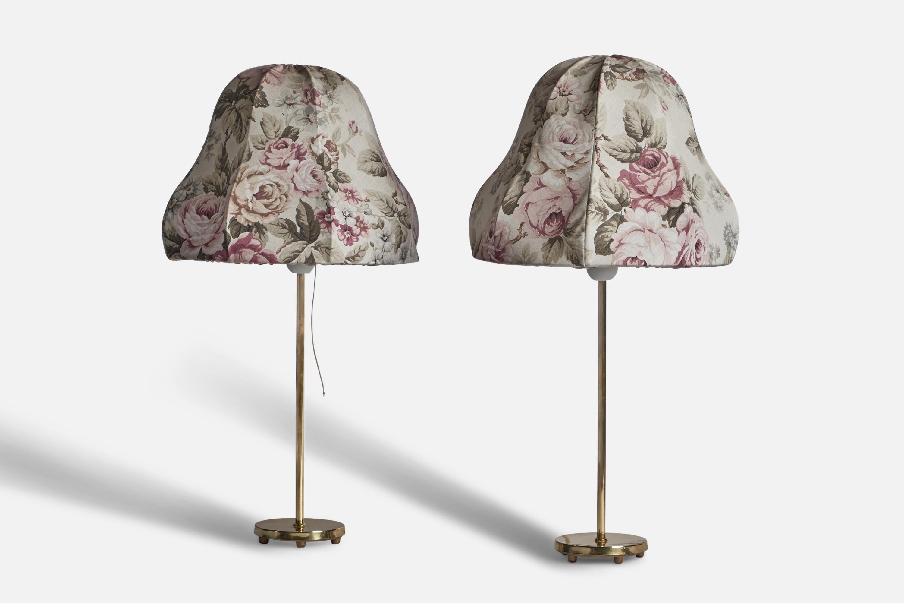 A pair of brass and floral printed fabric table lamps designed and produced in Sweden, c. 1940s.

Overall Dimensions (inches): 20.5” H x 11.5” Diameter

Bulb Specifications: E-26 Bulb

Number of Sockets: 1