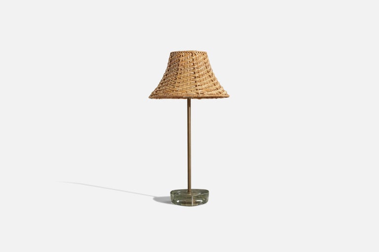 A pair of brass and glass table lamps, designed and produced by a Swedish designer, Sweden, c. 1950s.

Sold without lampshade. 
Dimensions of Lamp (inches) : 12.625 x 4.25 x 4.25 (H x W x D)
Dimensions of Shade (inches) : 1.875 x 8.625 x 5.375