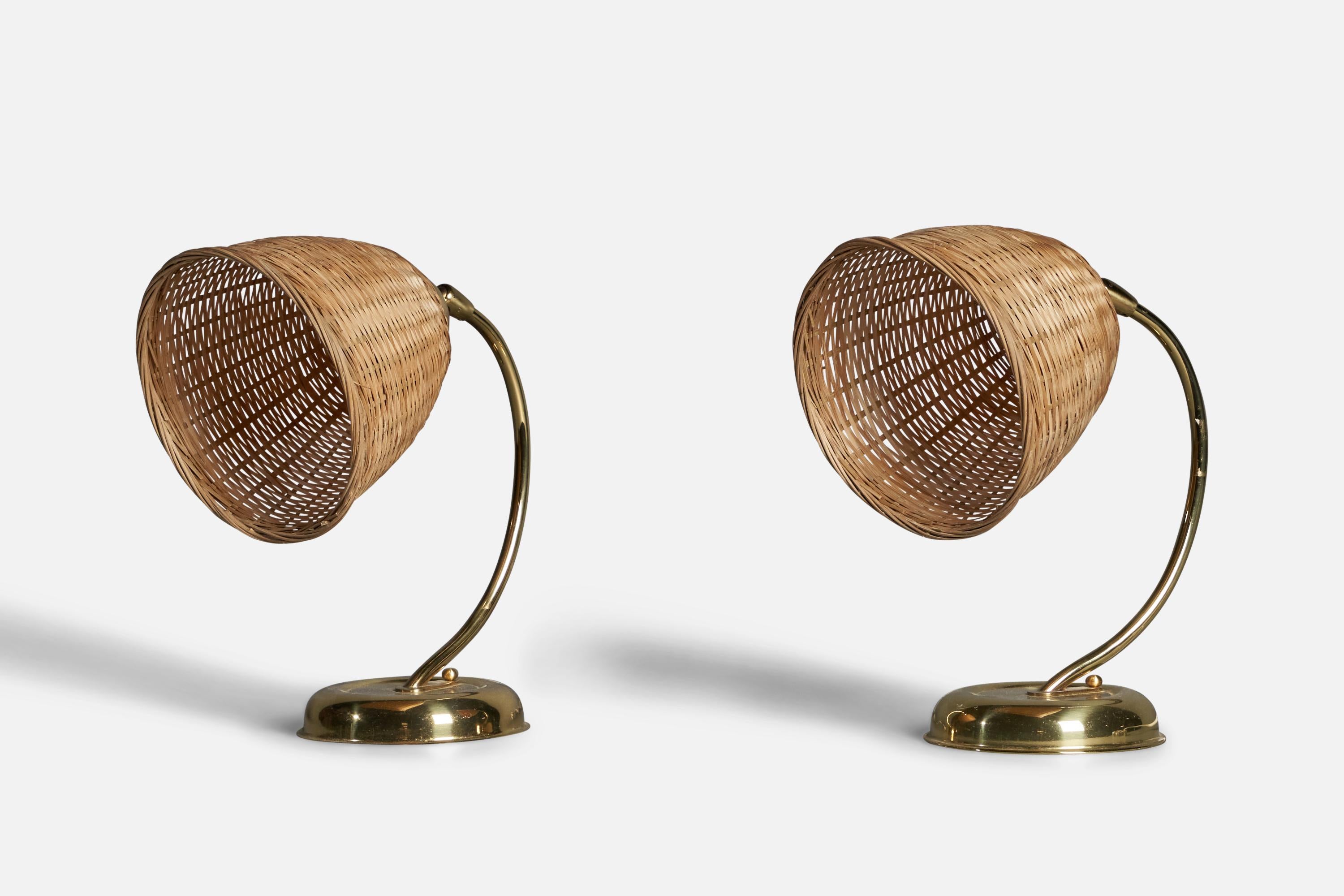 A pair of brass and rattan table lamps, designed and produced in Sweden, c. 1970s.

Overall Dimensions (inches): 10.5