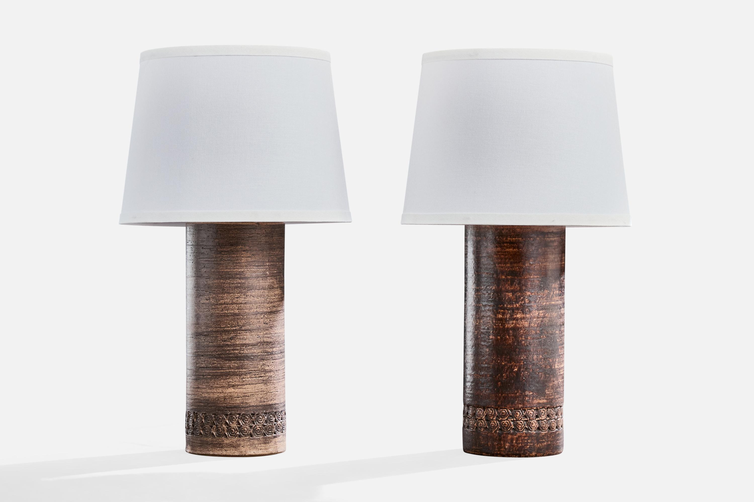 A pair of brown-glazed ceramic table lamps designed and produced in Sweden, c. 1960s.

Dimensions of Lamp (inches): 16.25