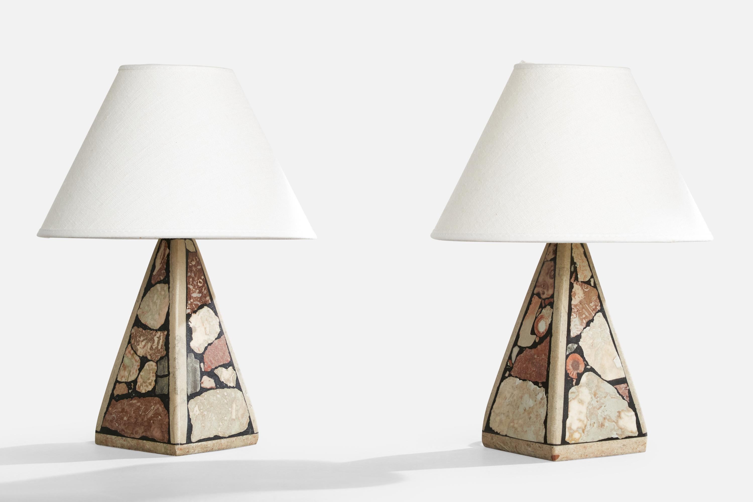 A pair of fossil stone table lamps designed and produced in Gotland, Sweden, c. 1970s.

Dimensions of Lamp (inches): 8.25” H x 3.5” W x 3.5” D

Dimensions of Shade (inches): 3.5” Top Diameter x 8” Bottom Diameter x 5.5” H

Dimensions of Lamp with