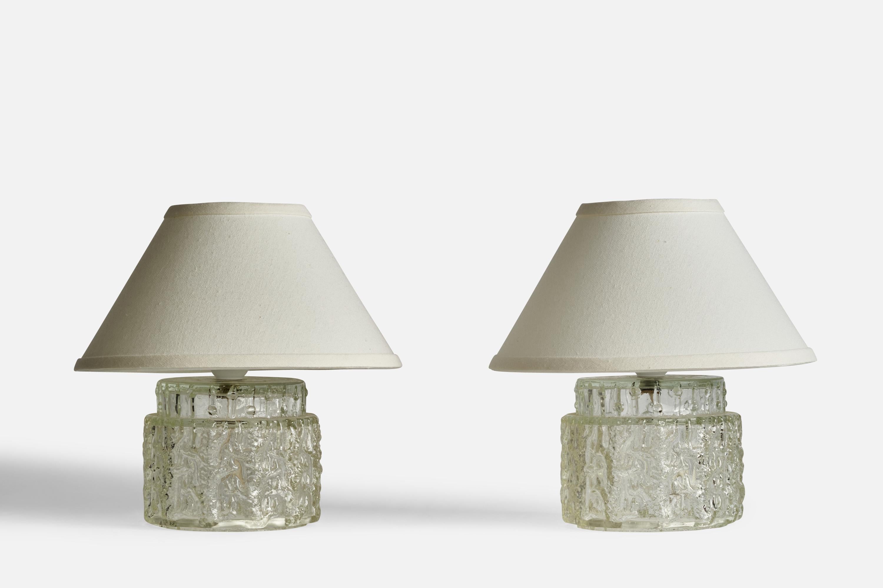 A pair of glass table lamps designed and produced in Sweden, 1960s.

Dimensions of Lamp (inches): 7” H x 5.5” Diameter
Dimensions of Shade (inches): 4.25” Top Diameter x 10.25” Bottom Diameter x 5.5”
Dimensions of Lamp with Shade (inches): 10” H x