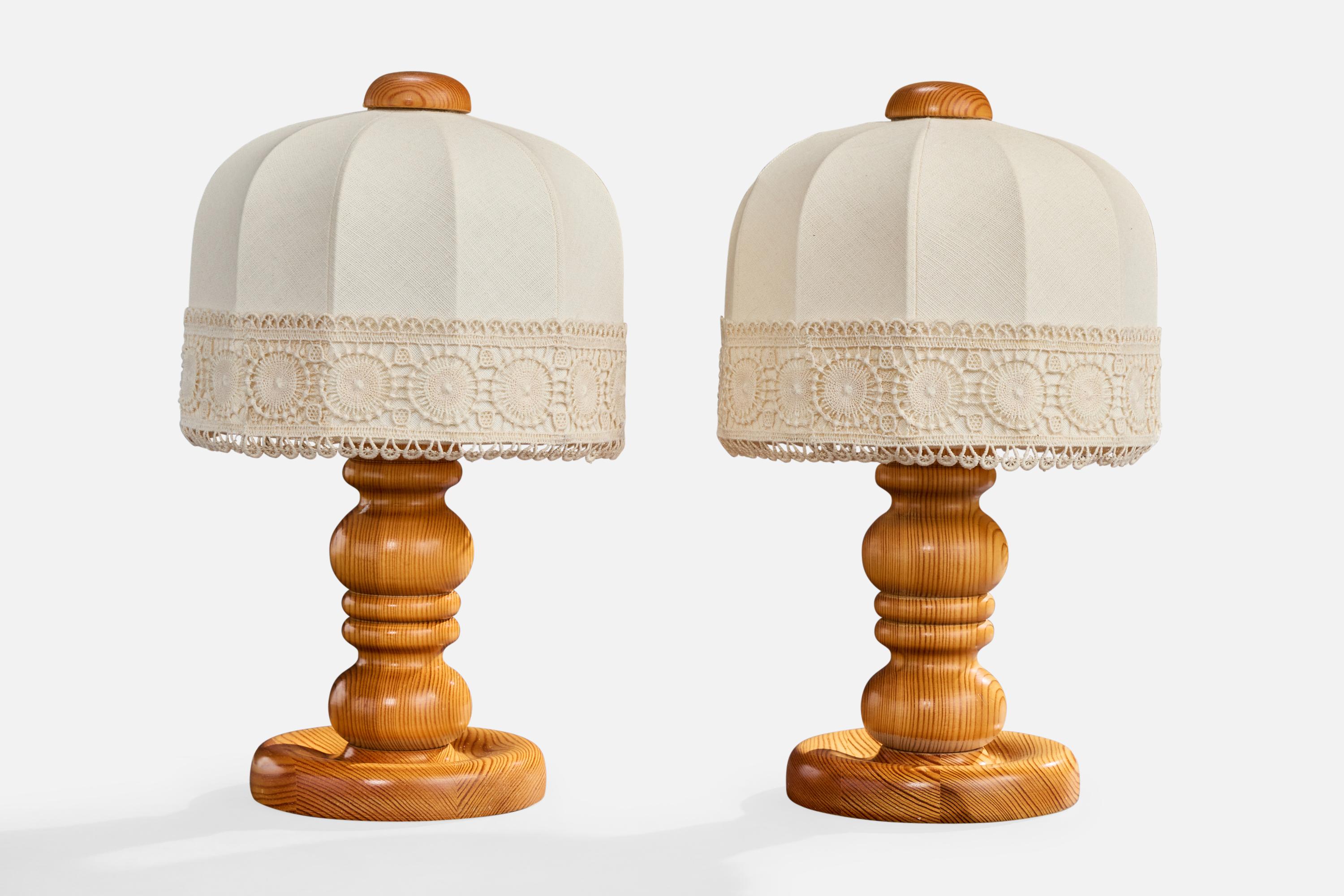 A pair of pine and off-white embroidery fabric table lamps designed and produced in Sweden, c. 1970s.

Overall Dimensions (inches): 16.5