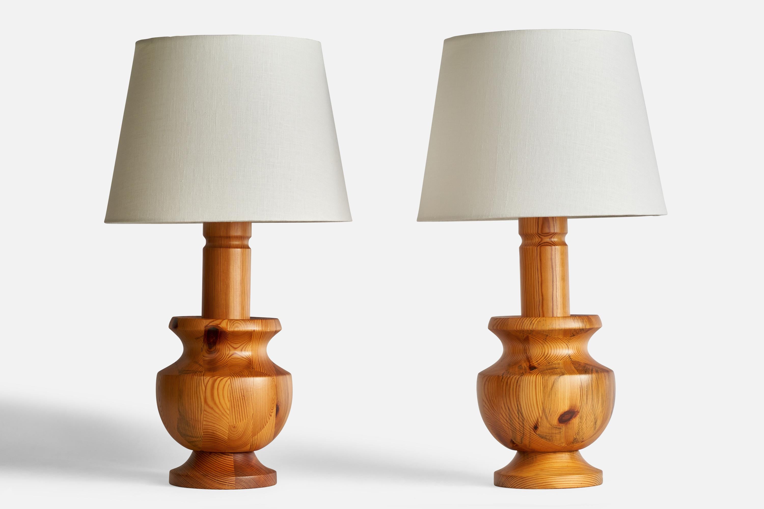 A pair of pine table lamps designed and produced in Sweden, c. 1960s.

Dimensions of Lamp (inches): 16.25” H x 6.5” Diameter
Dimensions of Shade (inches): 9”  Top Diameter x 12”  Bottom Diameter x 8.75” H
Dimensions of Lamp with Shade (inches): 22”