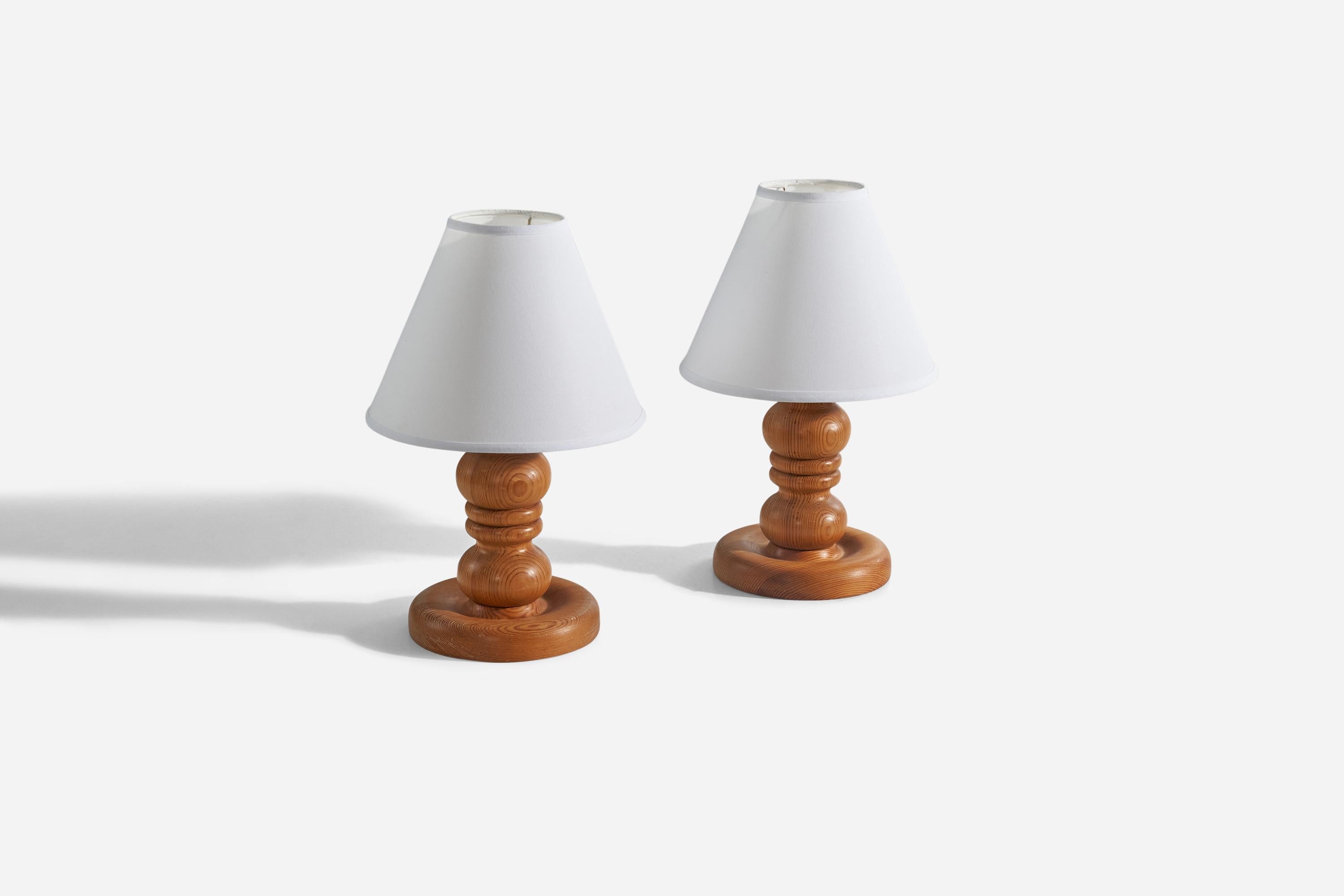 A pair of pine table lamps designed and produced in Sweden, 1970s. 

Sold without lampshades. 
Dimensions of lamp (inches) : 11.06 x 7 x 7 (H x W x D)
Dimensions of shade (inches) : 4.25 x 10.25 x 8 (T x B x S)
Dimension of lamp with shade