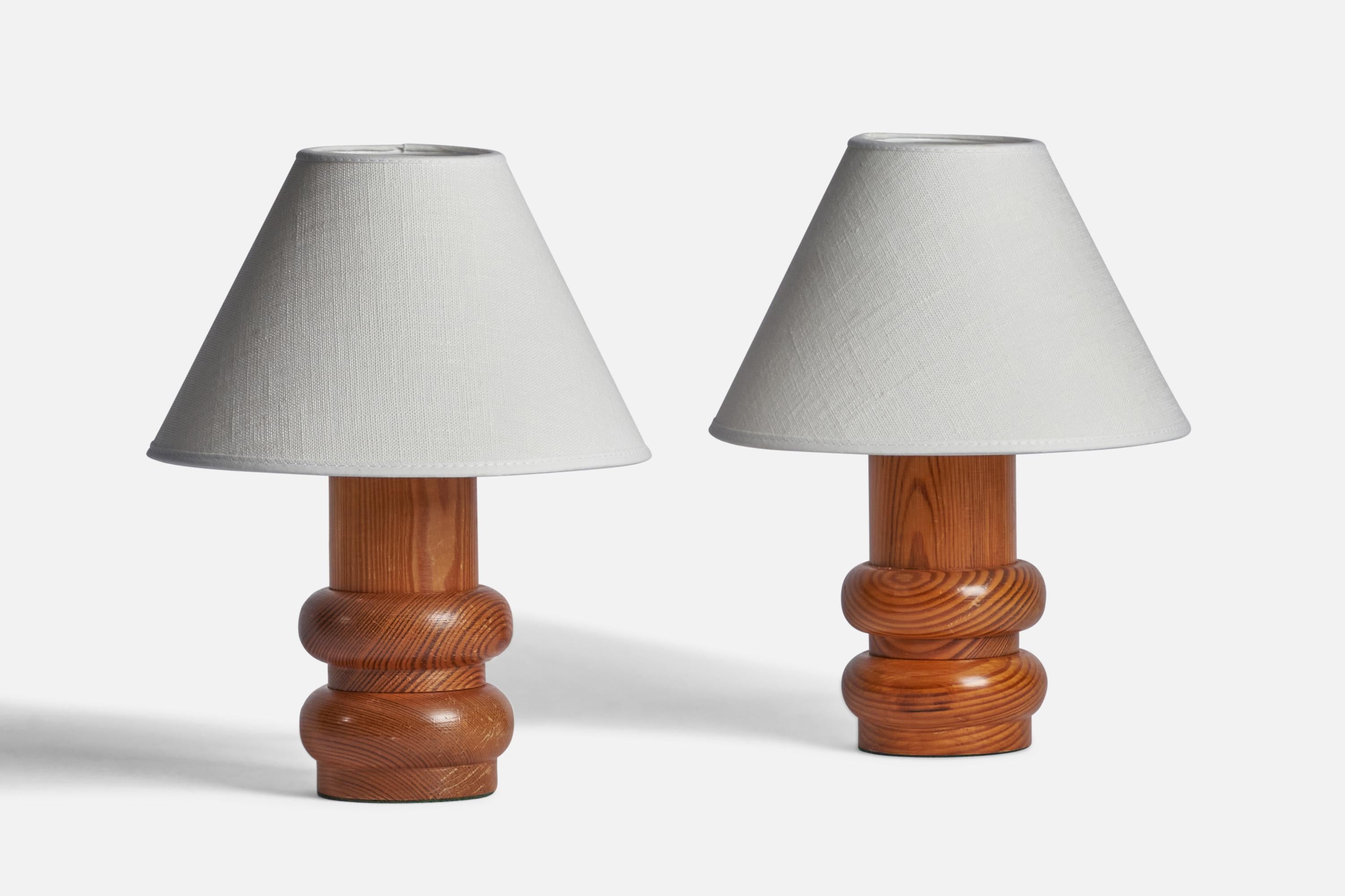 A pair of pine table lamp designed and produced in Sweden, 1970s.

Dimensions of Lamp (inches): 7.5” H x 3.5” Diameter
Dimensions of Shade (inches): 3” Top Diameter x 8” Bottom Diameter x 5.4” H
Dimensions of Lamp with Shade (inches): 12” H x 8”