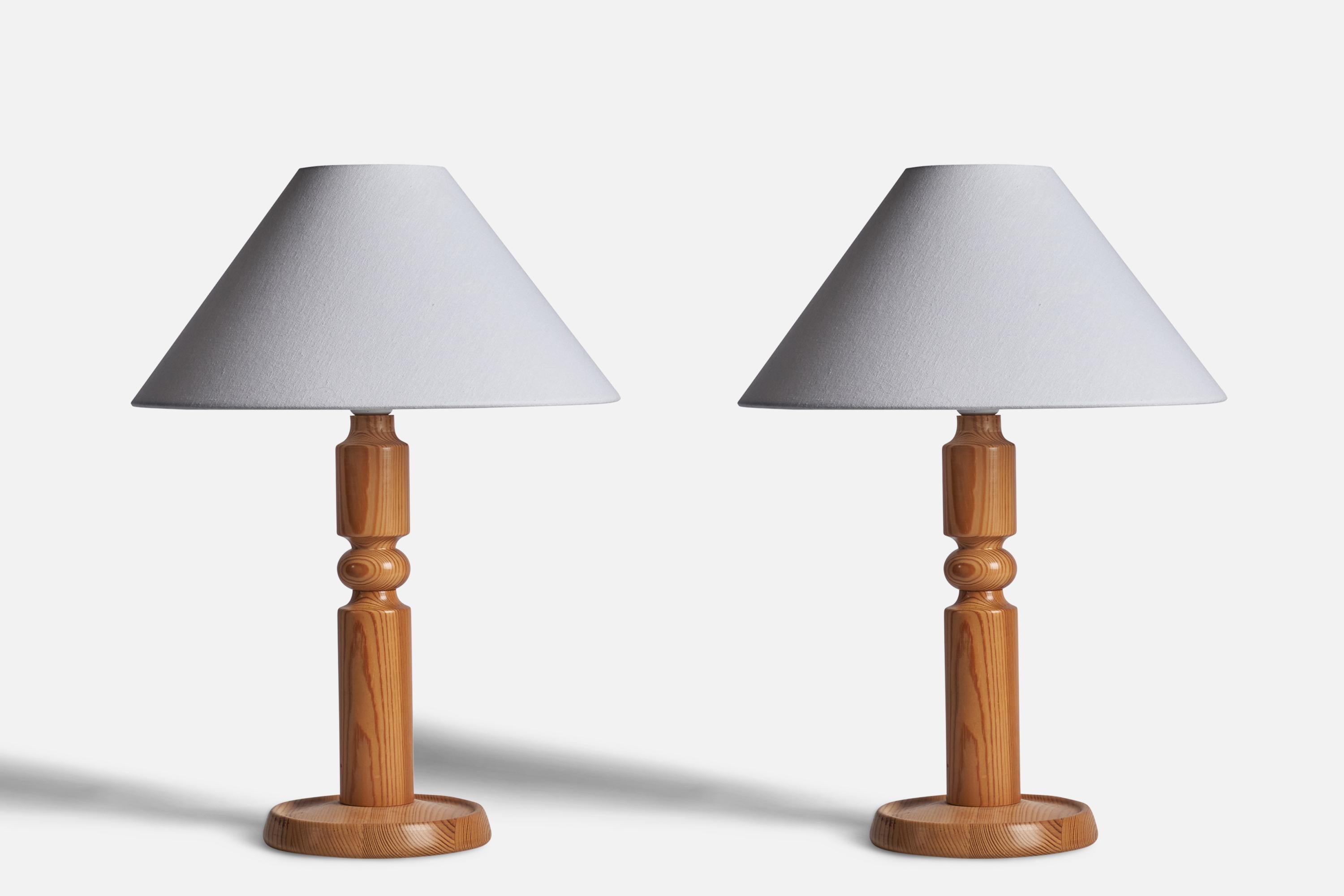 A pair of pine table lamps designed and produced in Sweden, c. 1970s.

Dimensions of Lamp (inches): 17.25” H x 7.4” Diameter
Dimensions of Shade (inches): 4.5” Top Diameter x 15.75” Bottom Diameter x 9” H
Dimensions of Lamp with Shade (inches):